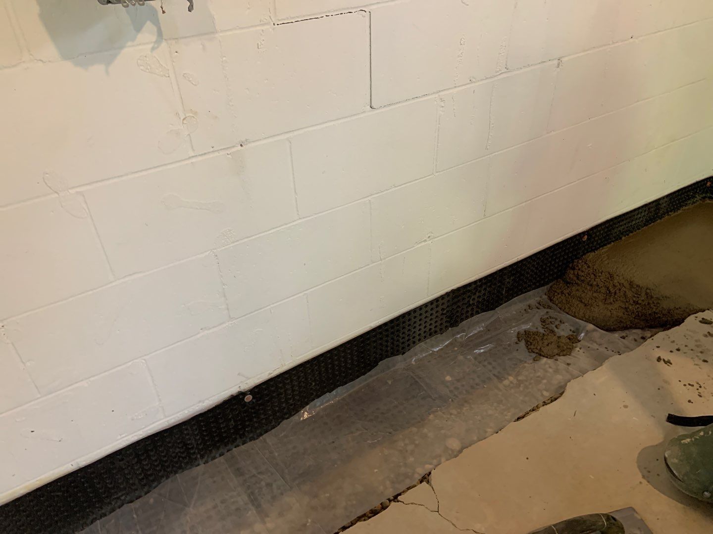 Correcting an Improper Installation for Alan in Chanhassen by Waterproofing Northeast