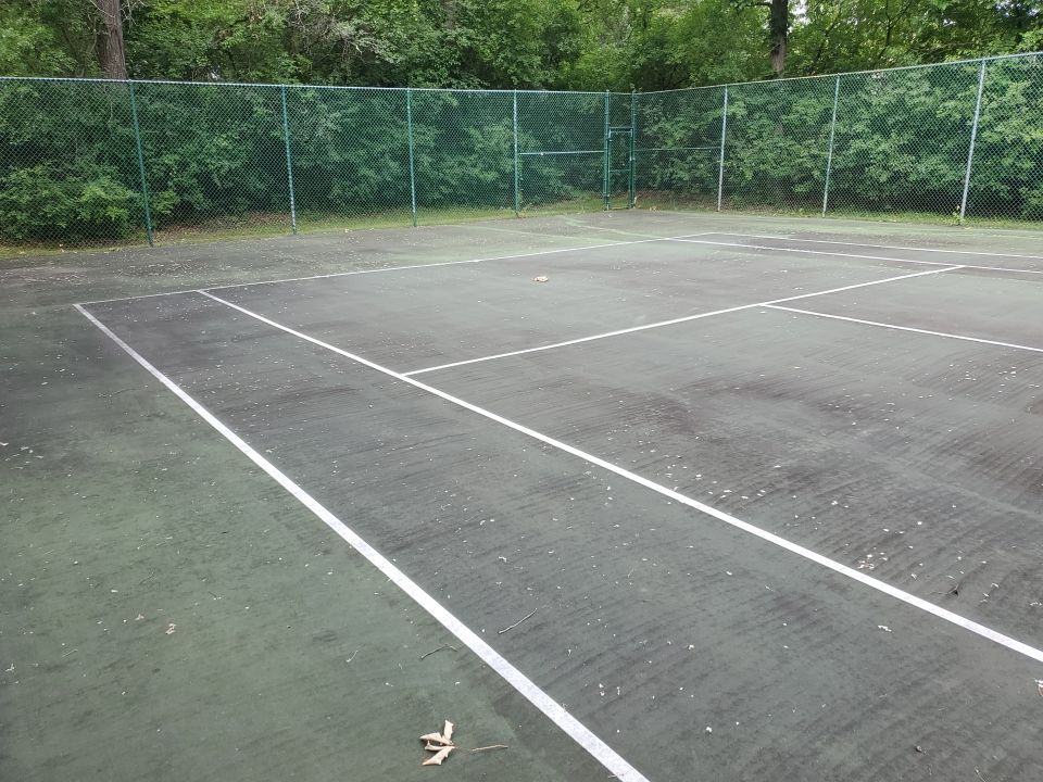 Tennis court cleaning by Northern Power Washing LLC.