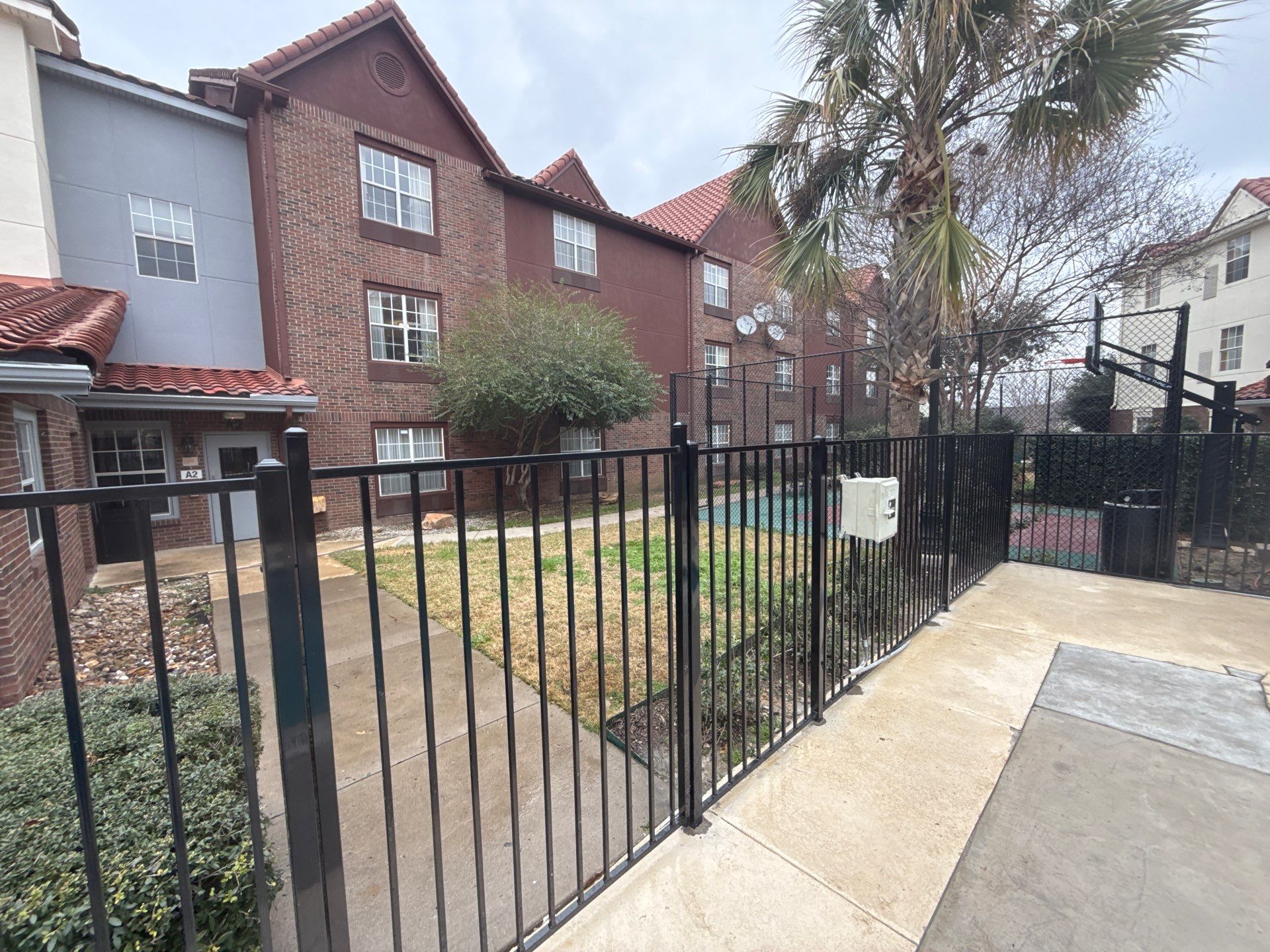 5' Wrought iron fencing w/ 10' vinyl chainlink by Grizzly Fence And Patio