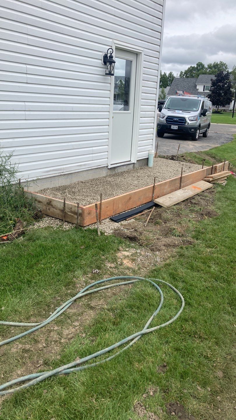 Stamped Concrete and Entry Door by Ivy Lea Construction
