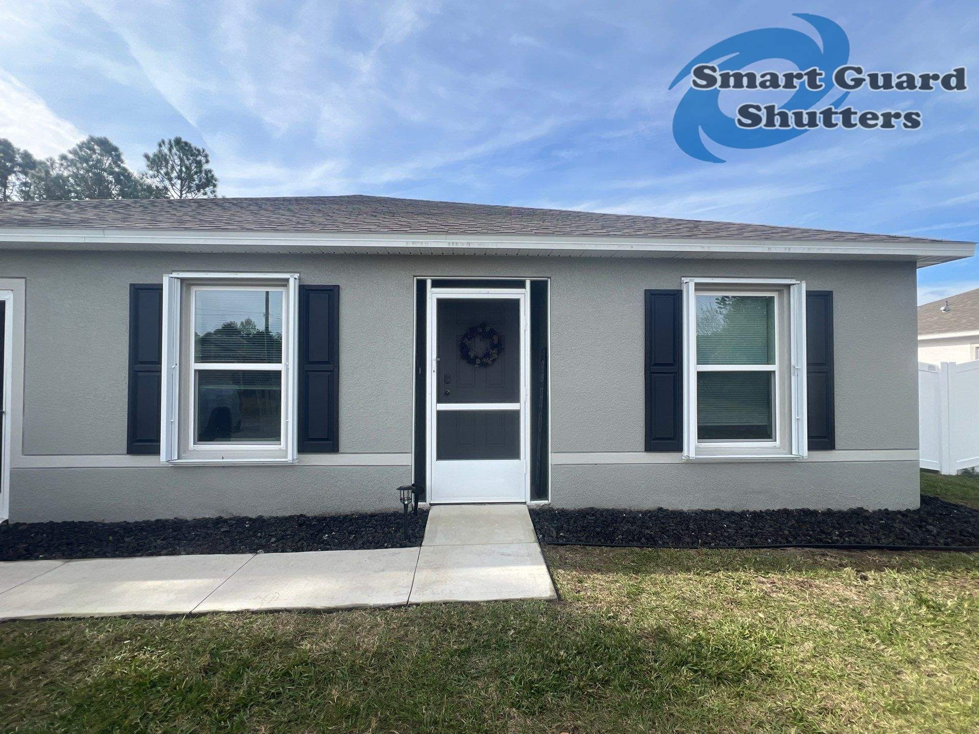 Accordion Shutters in White by Smart Guard Shutters