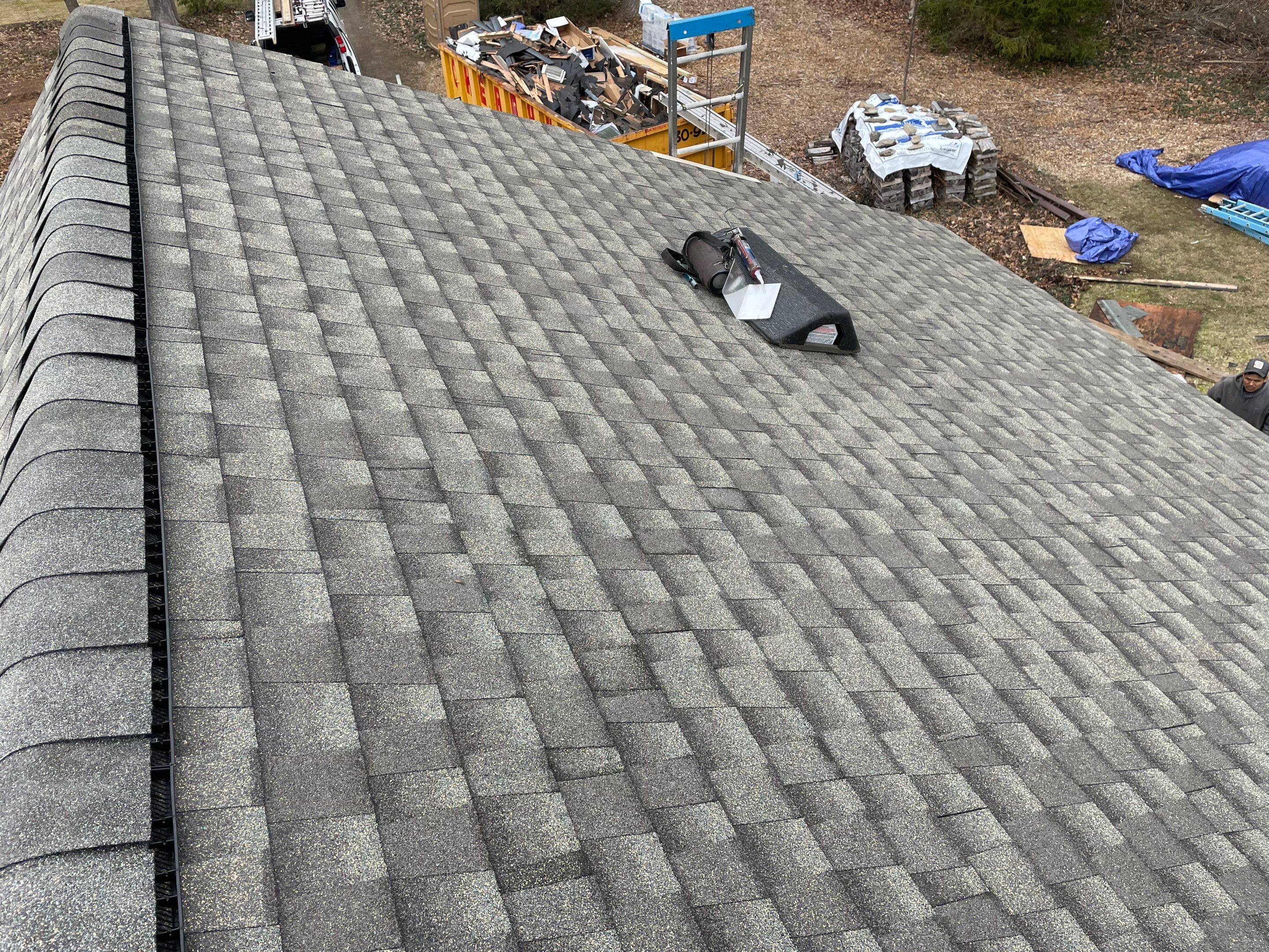 Asphalt shingles meet sleek siding in Guilford. by DiGiorgi Roofing and Siding Inc