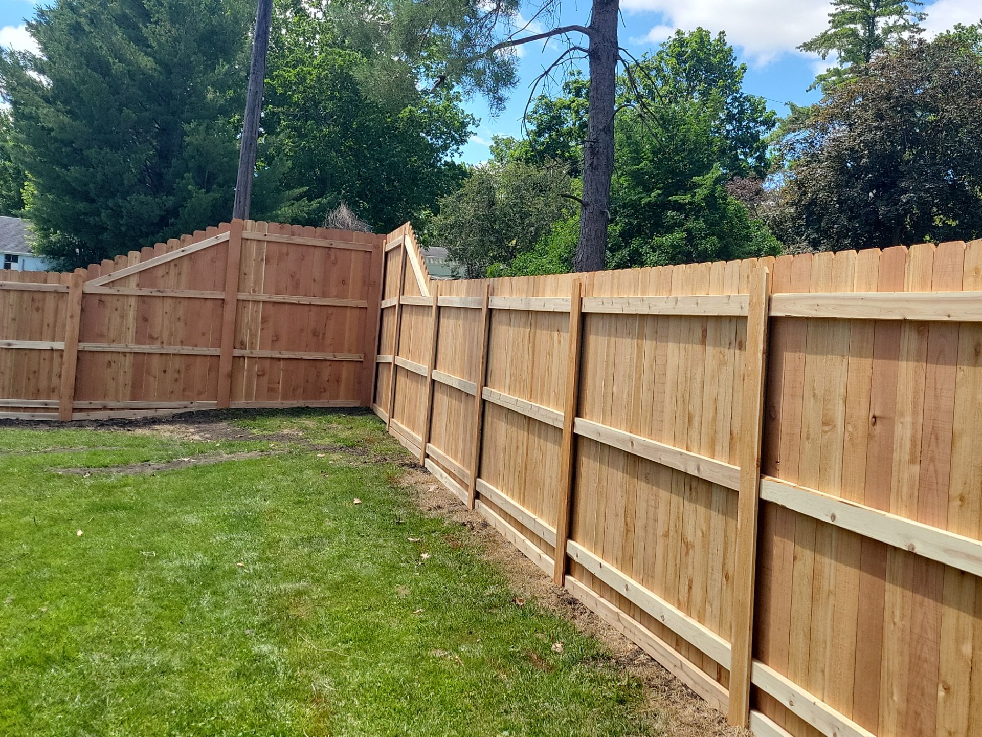 Custom Cedar Unstained Wood Privacy Fence Installation in Cedar Falls by Perfect Picket Fence and Stain