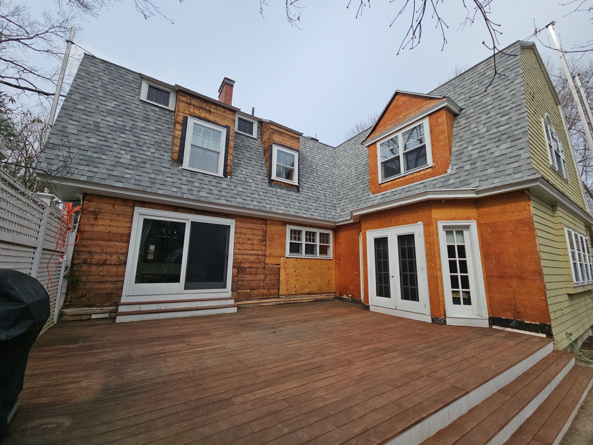 White cedar shingles and windows in Wayland, MA by UBrothers Construction
