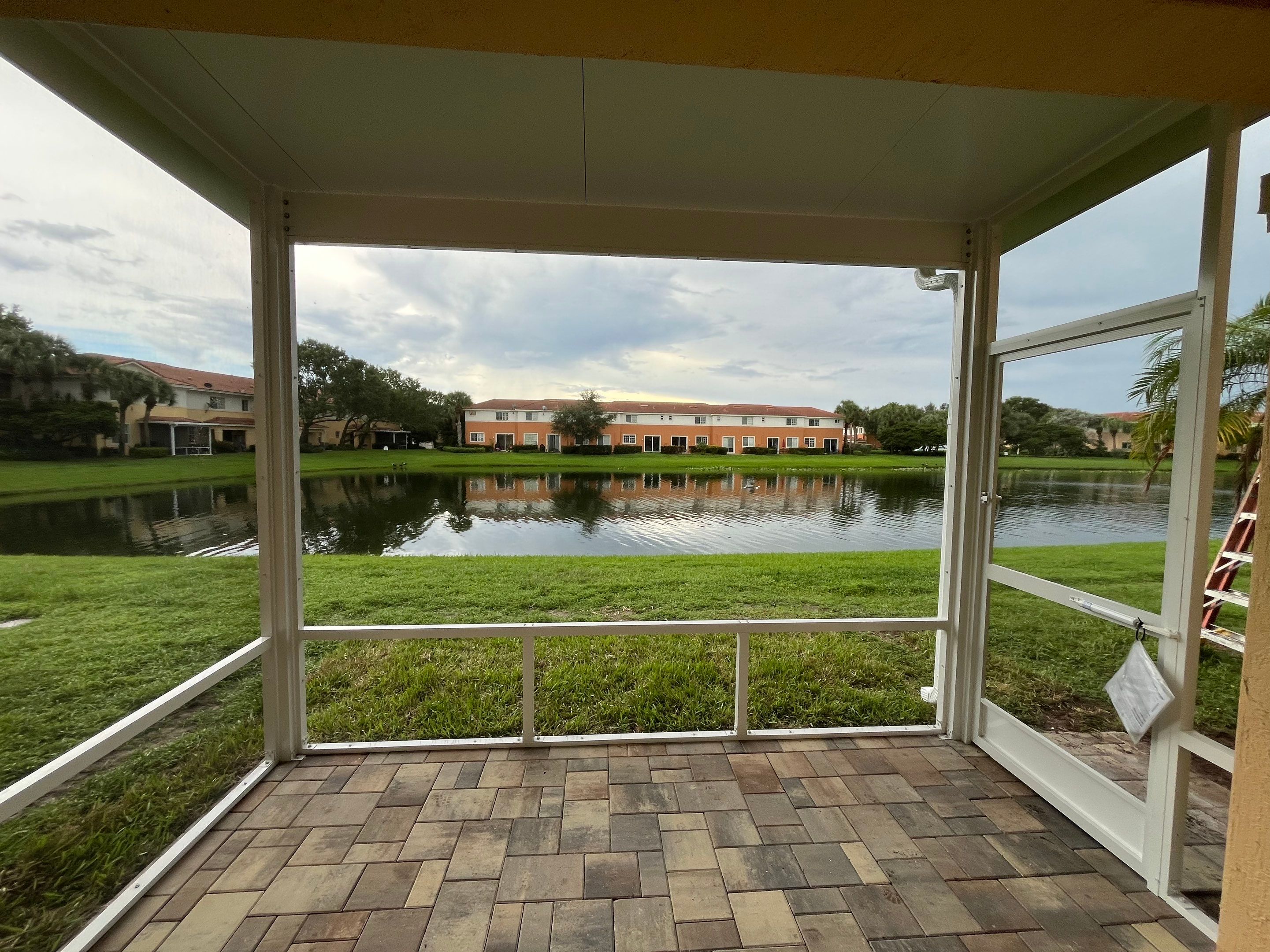 White Aluminum Screen Enclosure and Aluminum Roof Installation in Boynton Beach by The Screen Depot, Inc