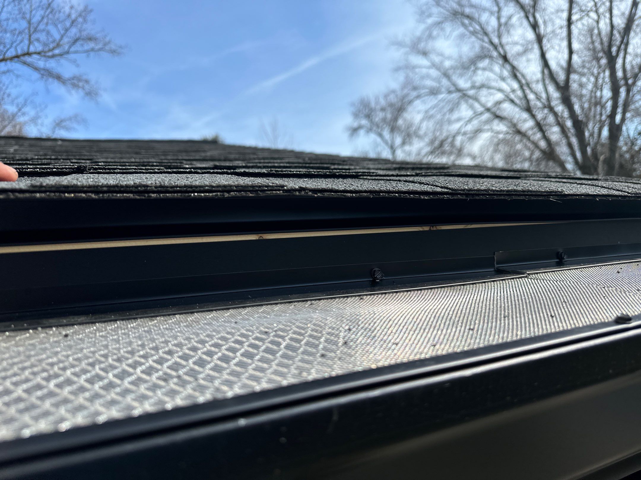 Blacked Out Gutters / Gutter Guards by American Home Contractors