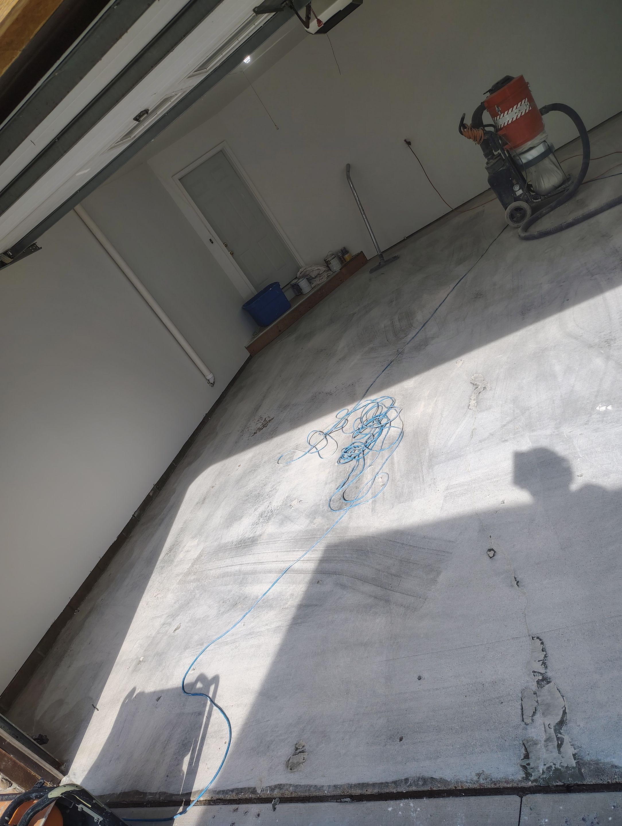 Sioux Falls Garage Floor Coating with Speckled Flake Finish by Select Painting, Coatings & Garage Cabinets
