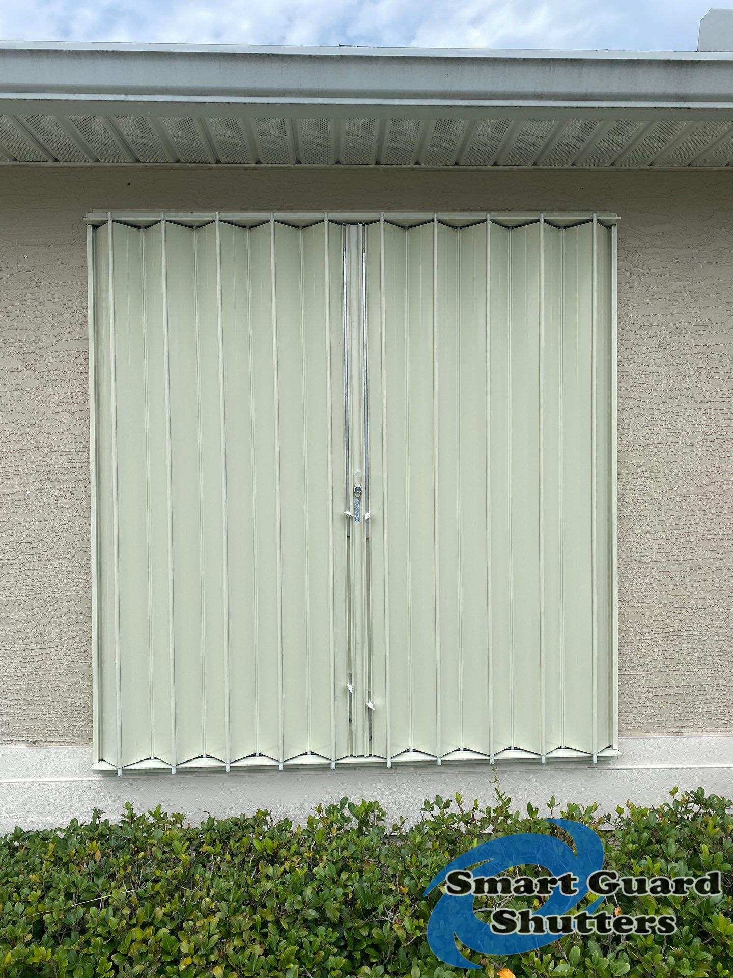 Accordion Shutters in Ivory  by Smart Guard Shutters