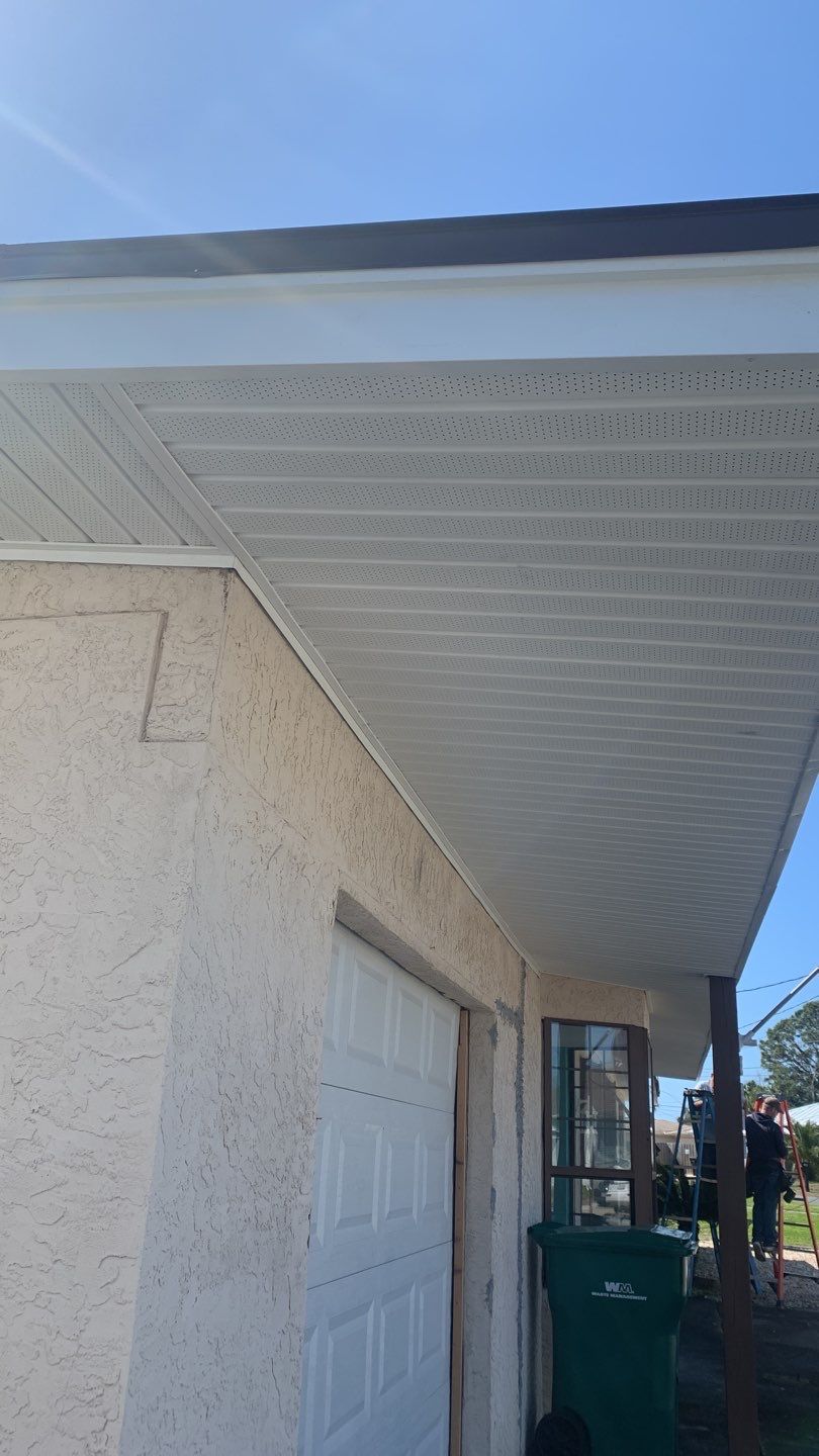 Soffit and Fascia Installation Using White Vinyl Soffit and Musket Brown Fascia by Gutter Professors