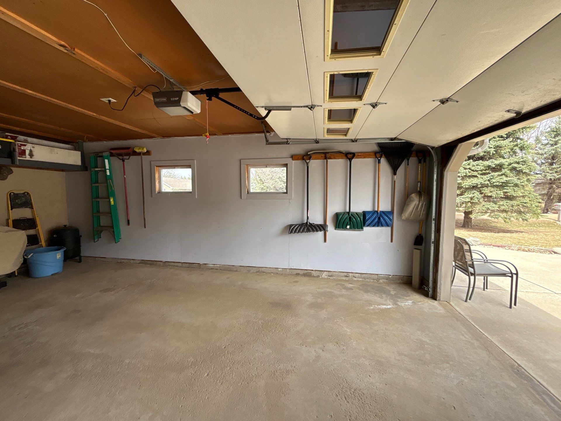 Full-Flake Epoxy Garage Floor Coating Installation in Sioux Falls by Select Painting, Coatings & Garage Cabinets