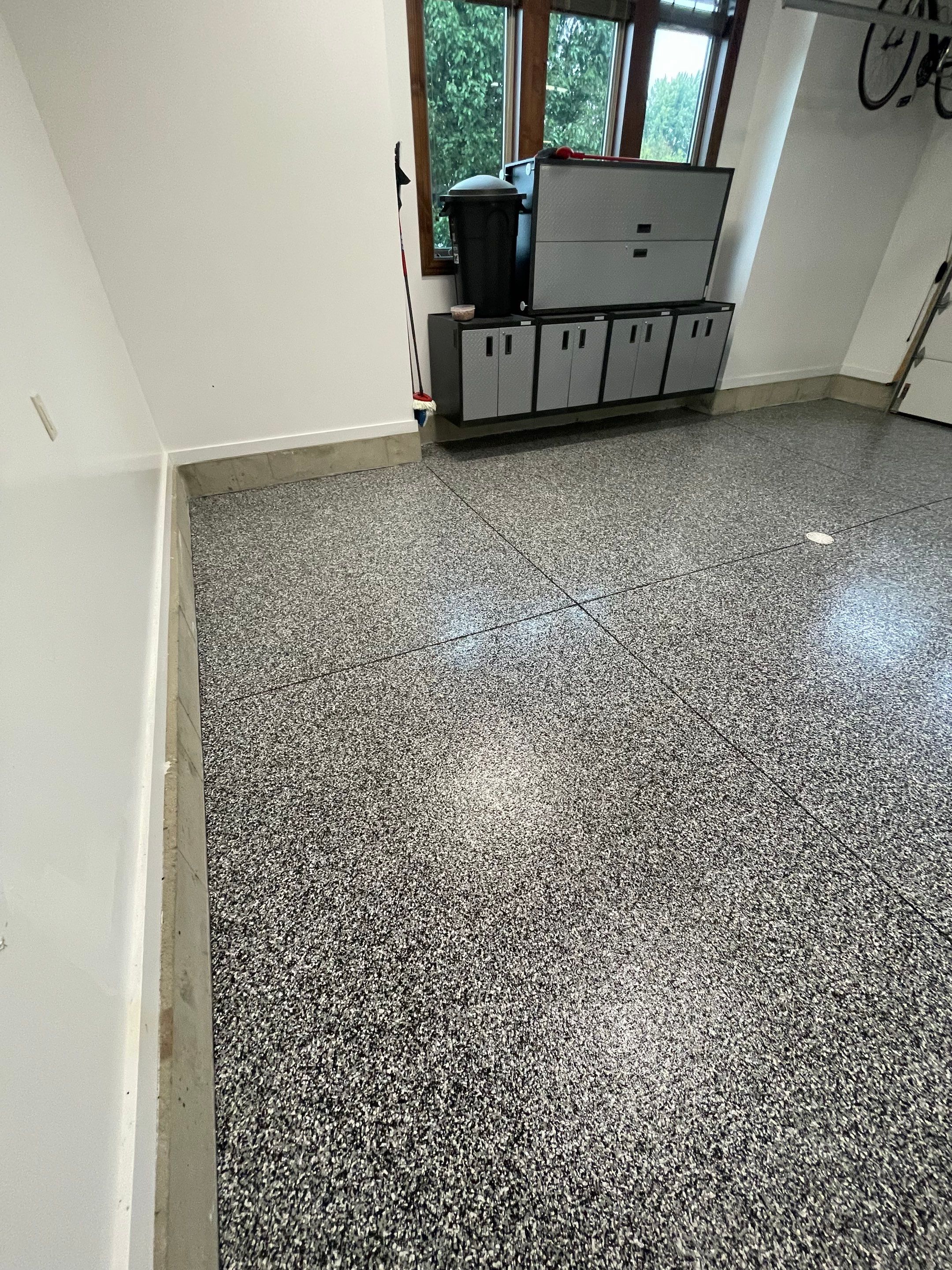 Garage Floor Coating and Domino Flake Finish in Sioux Falls by Select Painting, Coatings & Garage Cabinets