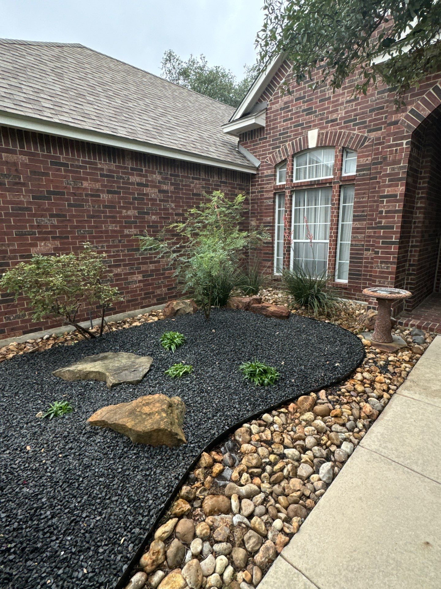 Landscaping Enhancement  using Texas Black Gravel by Hole In One Lawns, LLC