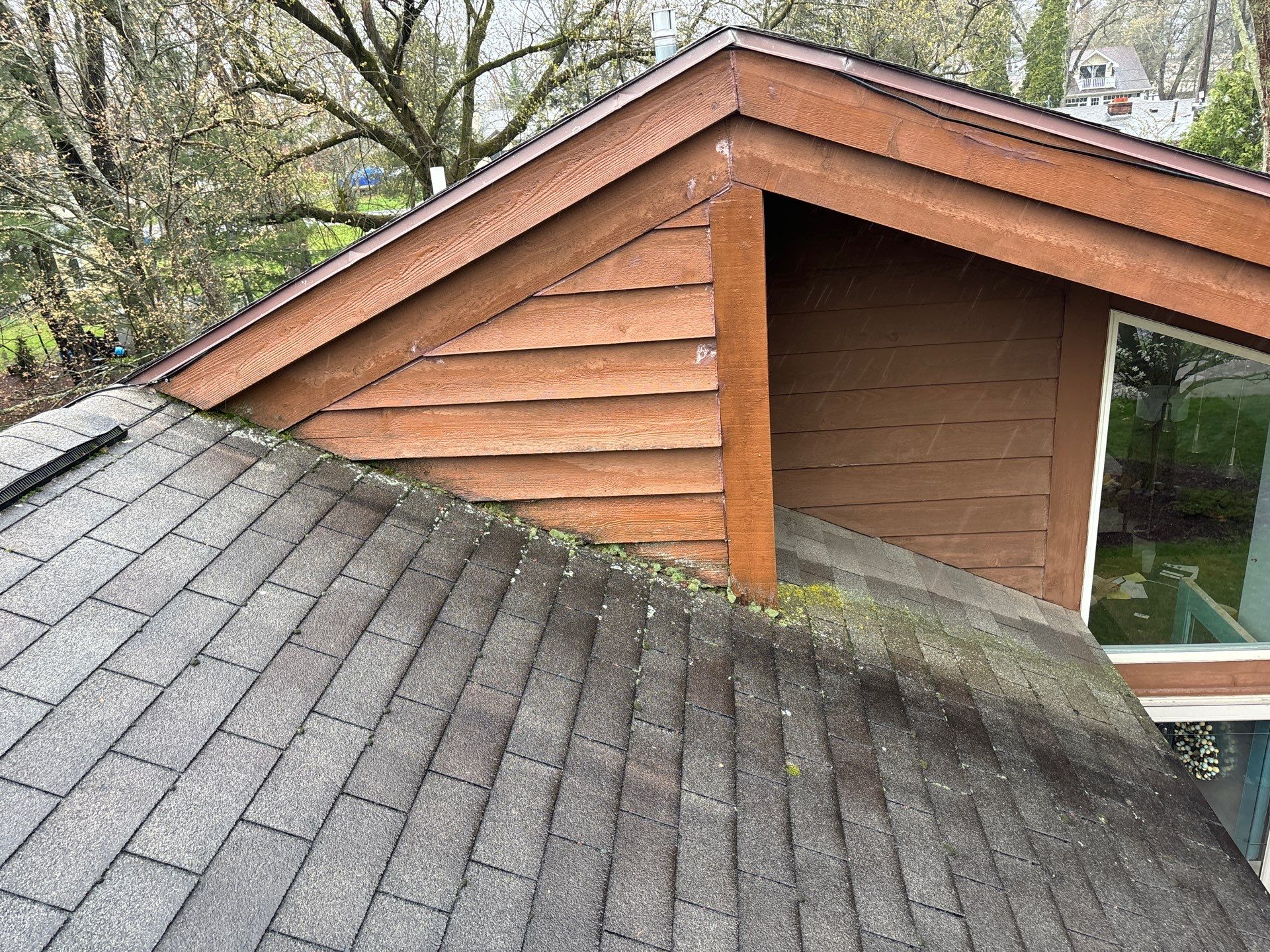 Installing new Roof and Gutter Protection after Hail Damage by Acme Exteriors