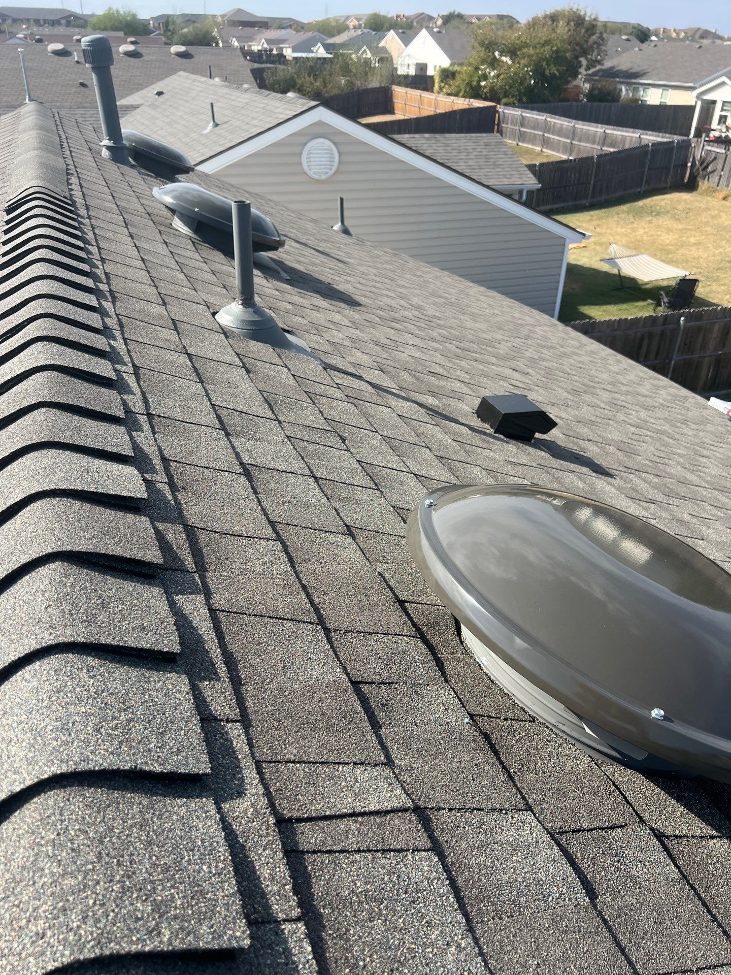 Roof Replacement and Gutter Installation in Edmond, OK by McCann's Roofing and Construction
