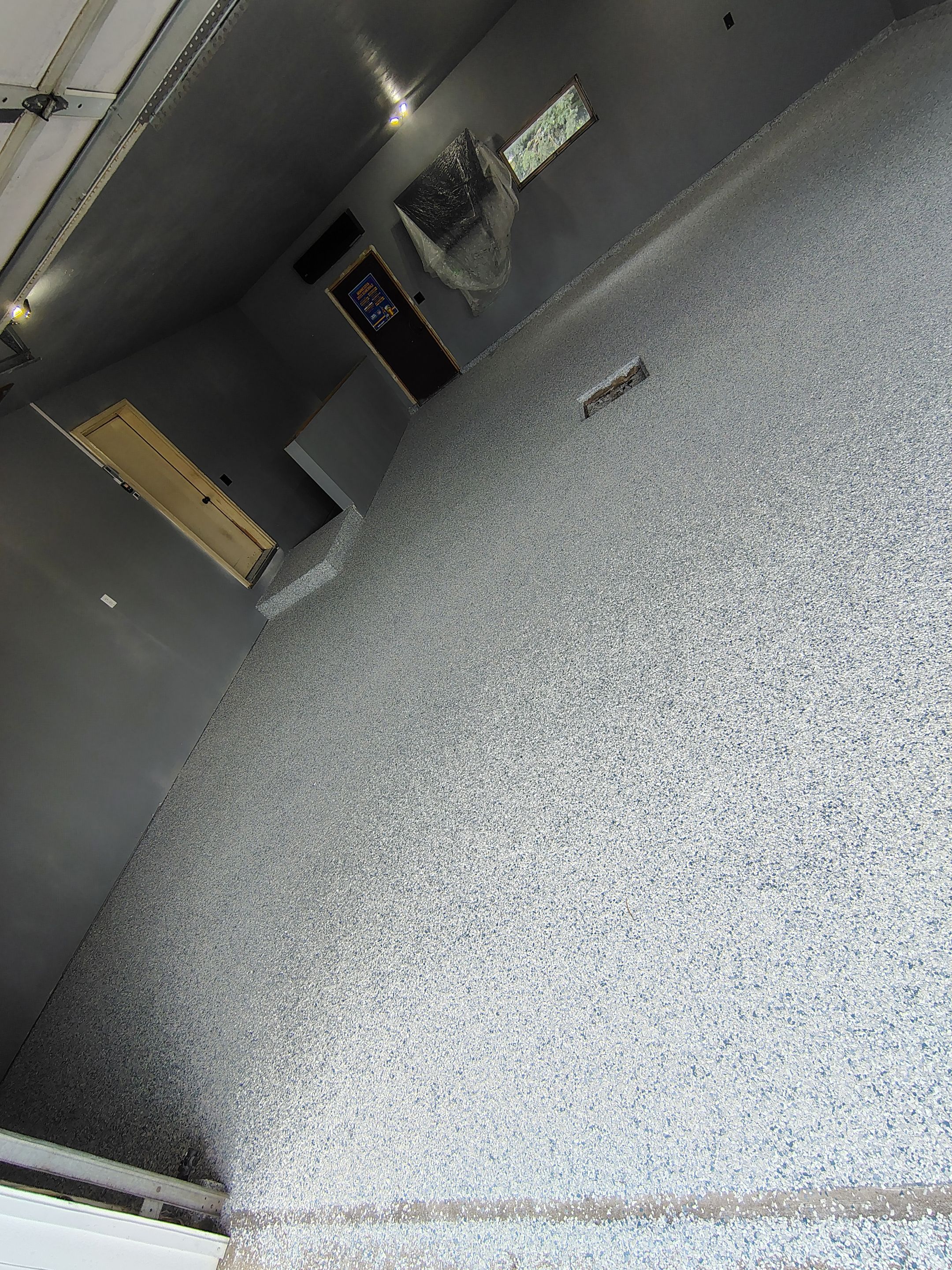 Garage Floor Concrete Coating and Surface Restoration in Colman by Select Painting, Coatings & Garage Cabinets
