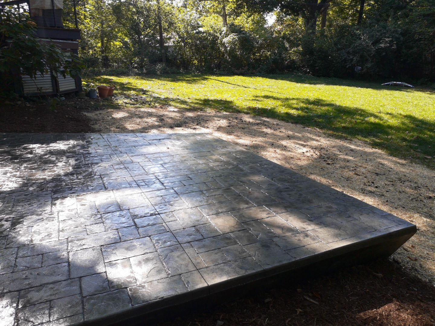 Back Yard Cantilivered Patio by LAND ESCAPES LLC