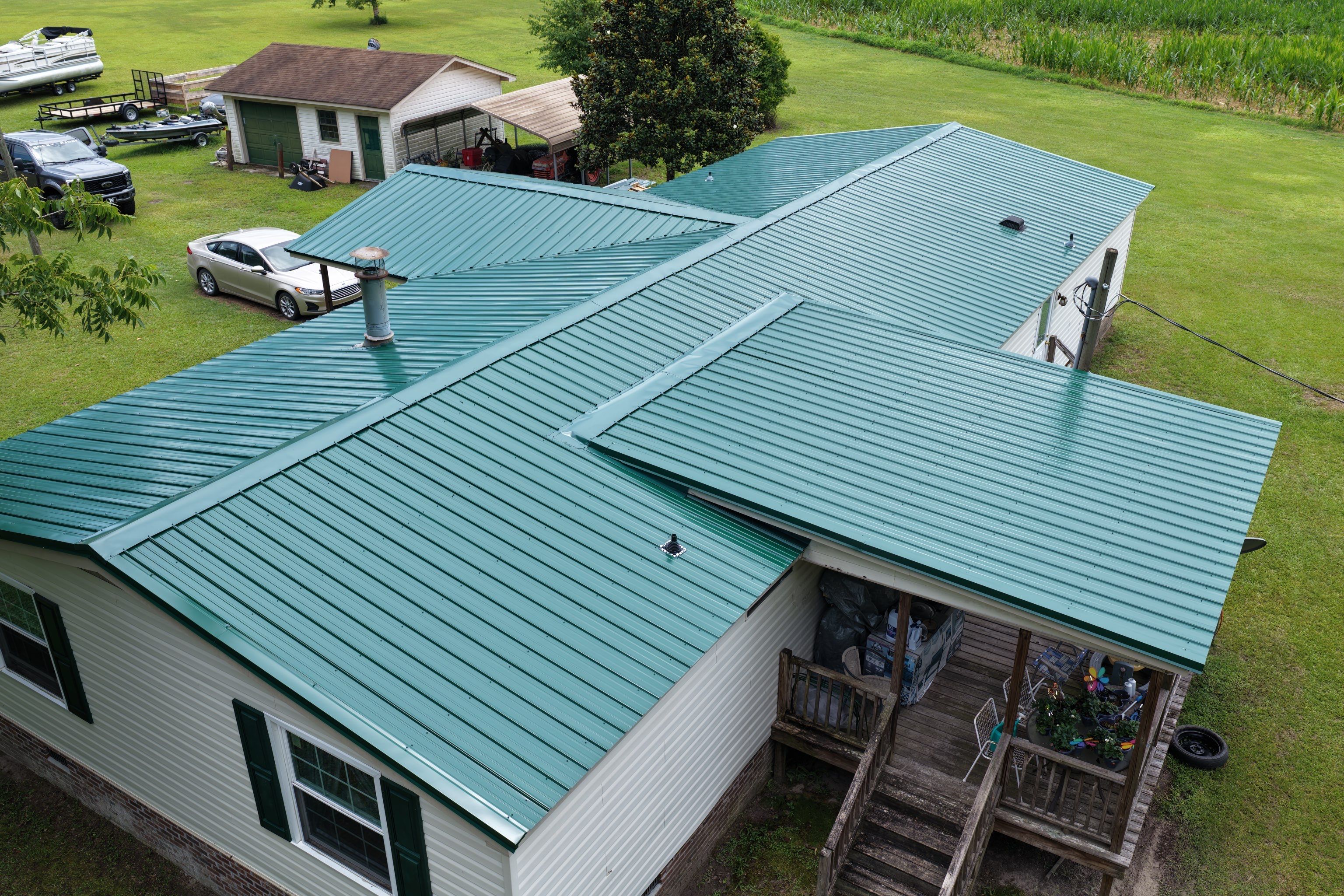 Standing Seam Green Metal Roof Installation in Sumter by Exterior Genie, LLC