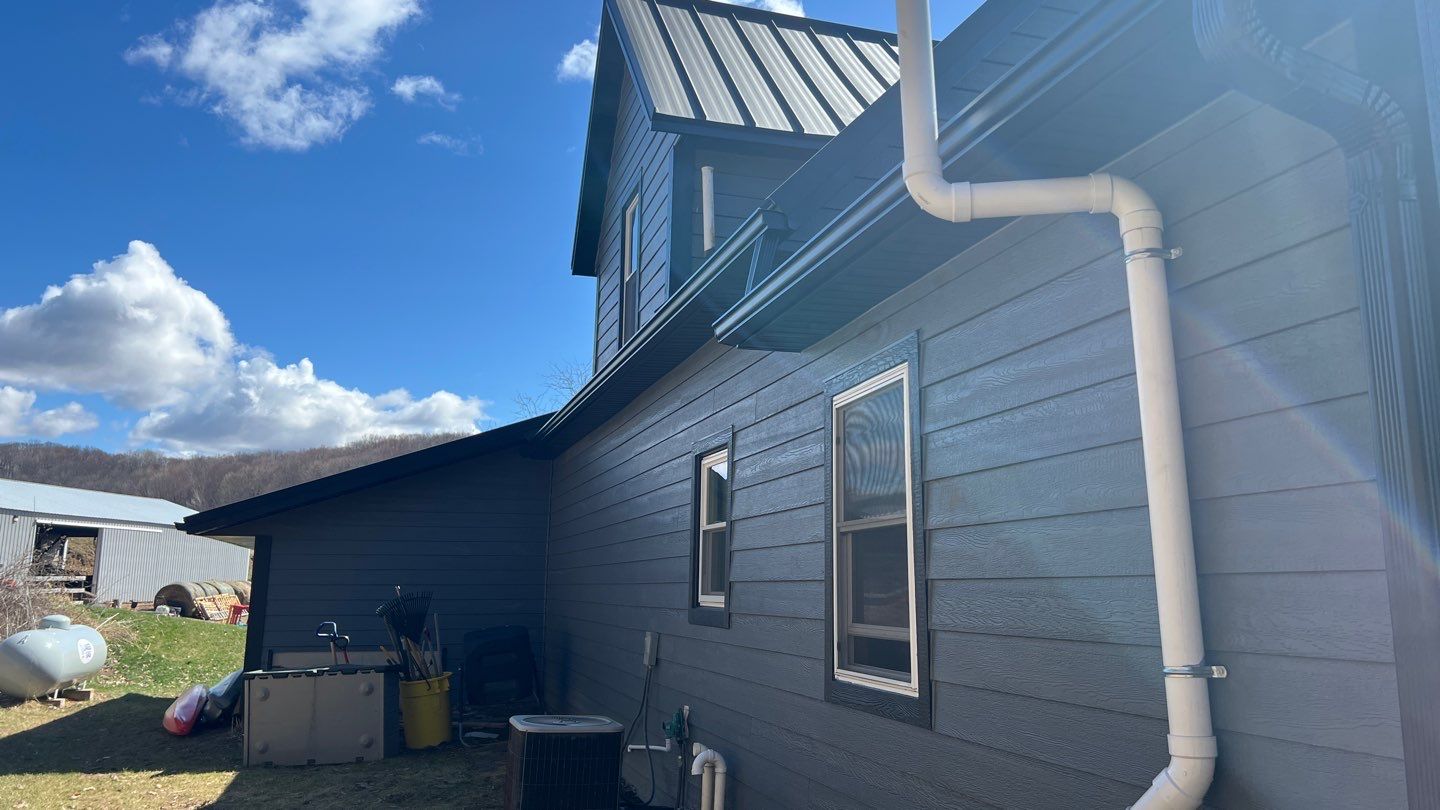 Stunning Home Exterior Makeover | Metal Roofing & LP Smart Siding by Total Restoration Services by LeFever Roofing LLC
