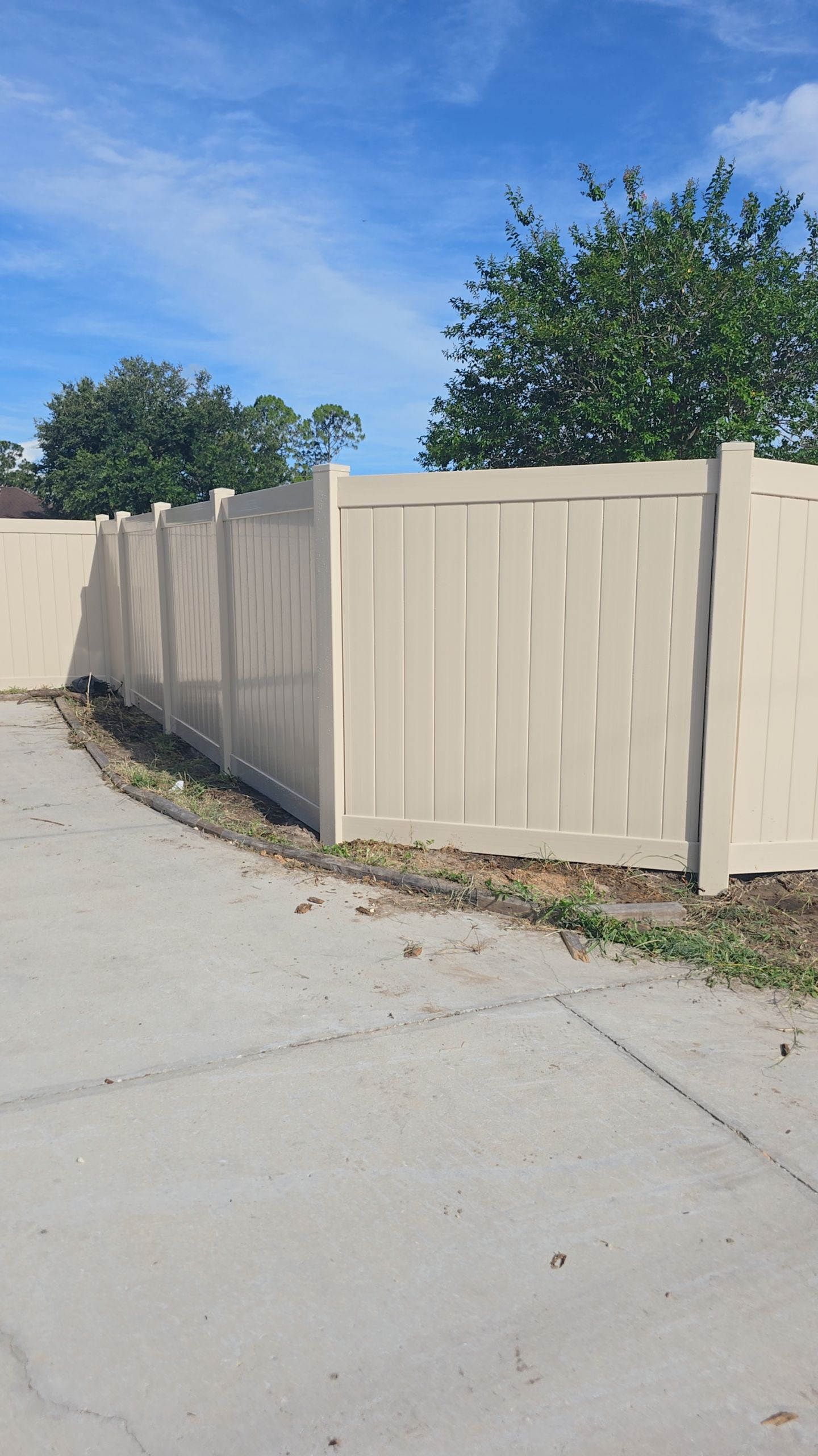 Tan Vinyl Privacy Fence and Gate Installation in North Port by True Fence LLC