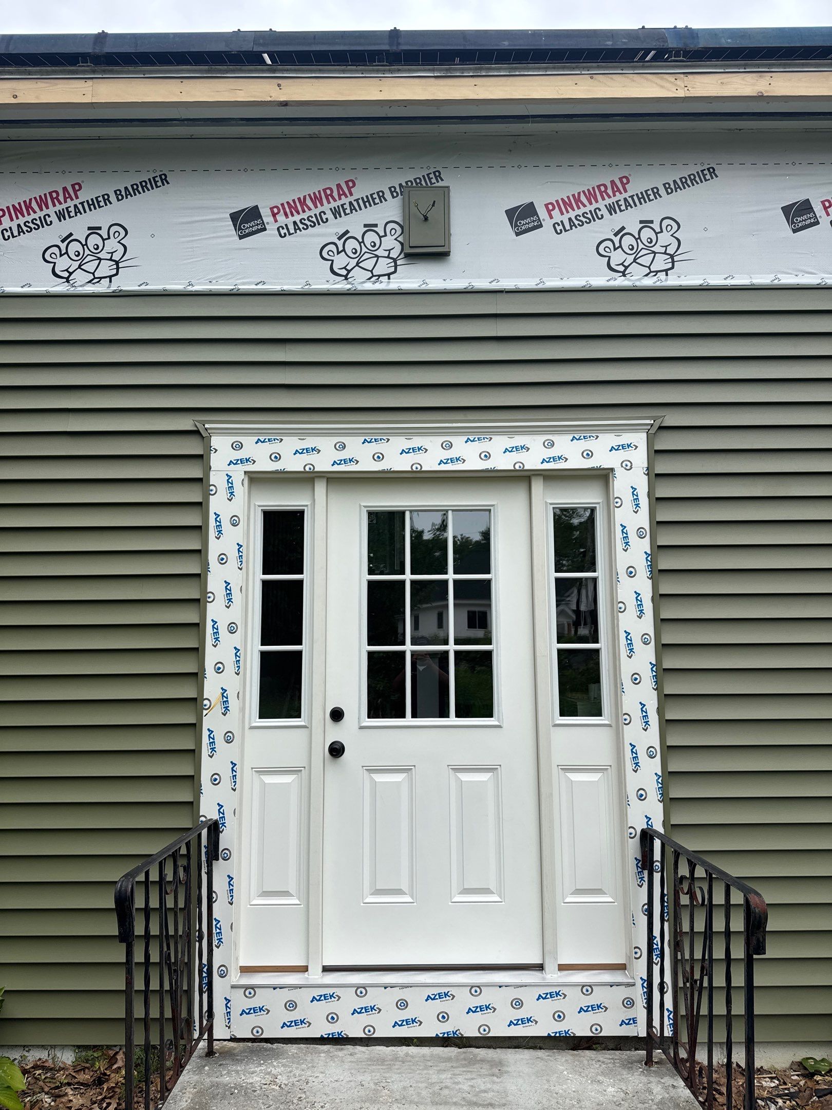 Full Siding Replacement in Newmarket, NH with CertainTeed Vinyl Siding and New Front Door Installation by Compass exteriors