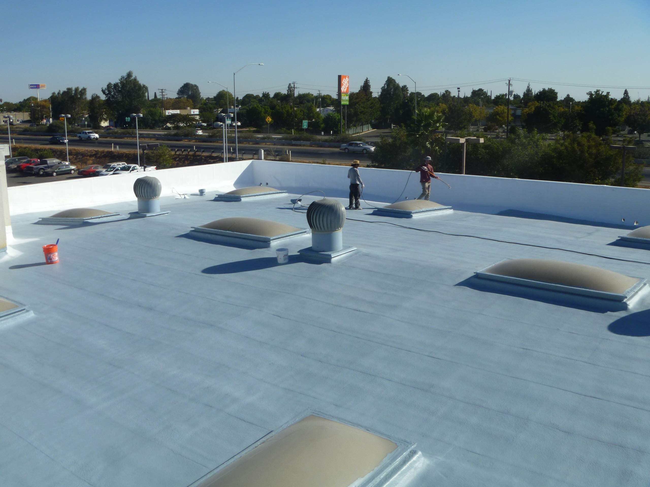 Commercial Roofing Installation using Spray foam and Conklin Benchmark/PUMA XL 18 yr warranty coatings by Straight Edge Roofing Inc