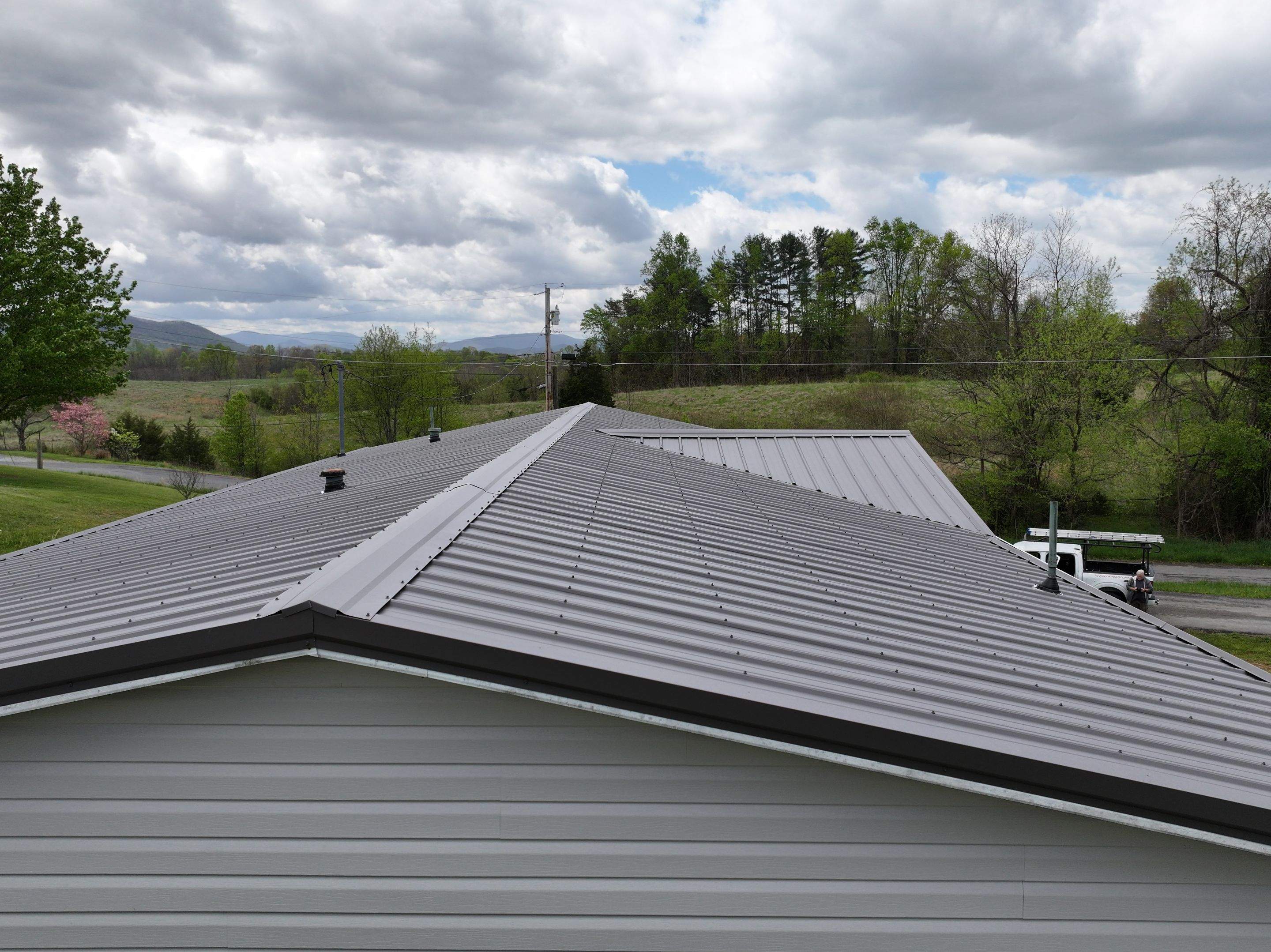 Charcoal Gray Textured Metal Roof by Omnia Roofing