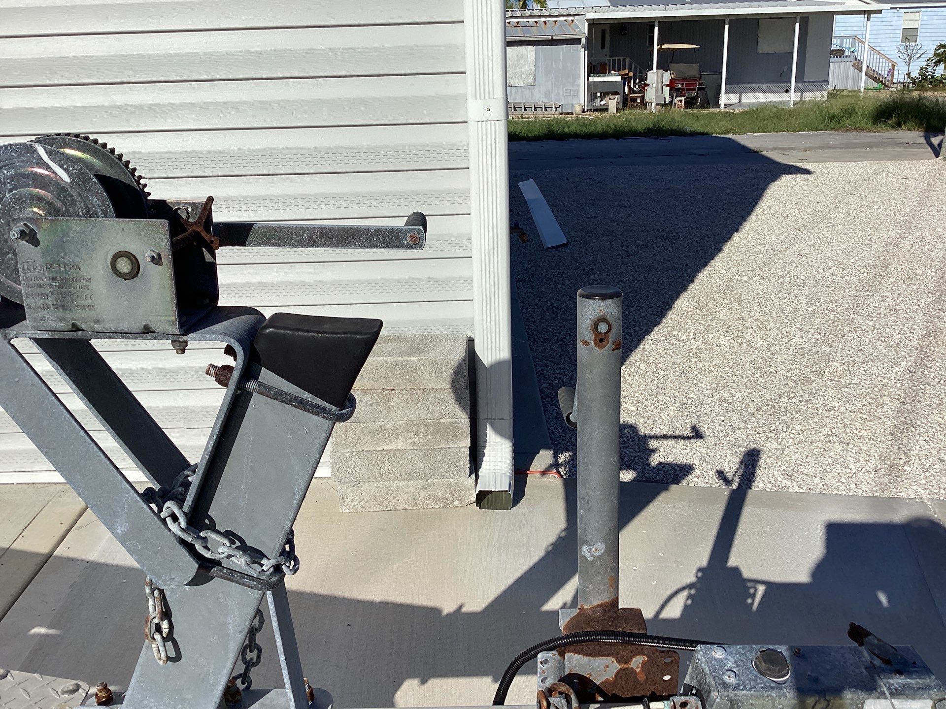 White Downspouts Installation in St. James City by Gutter Professors