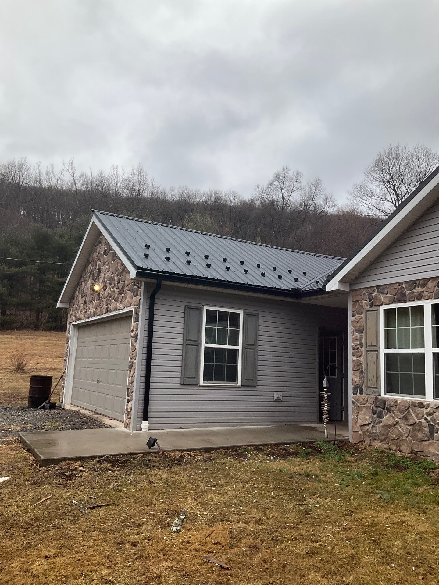 Black Metal Roof Replacement and Gutter Installation in Halifax by Esh Builders