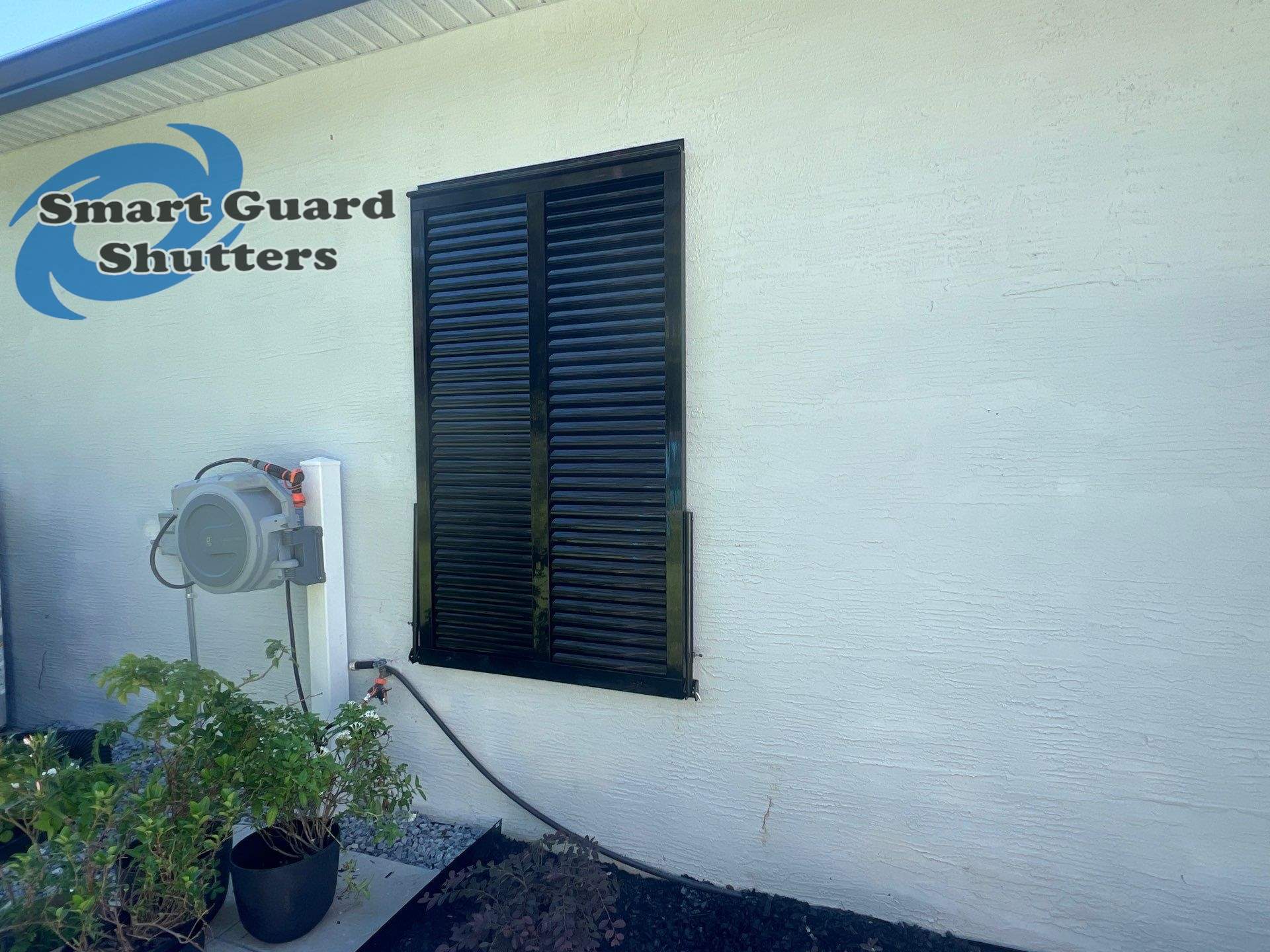 Impact Bahama Shutters in Jet Black by Smart Guard Shutters