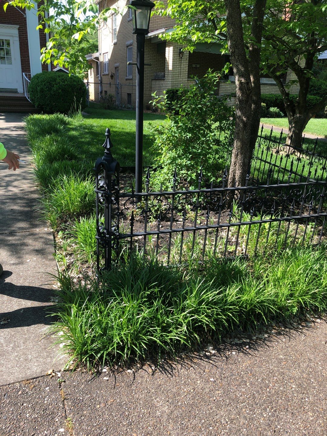 Liriope grasses, mulch and stone pavers by GrassBusters, Inc.