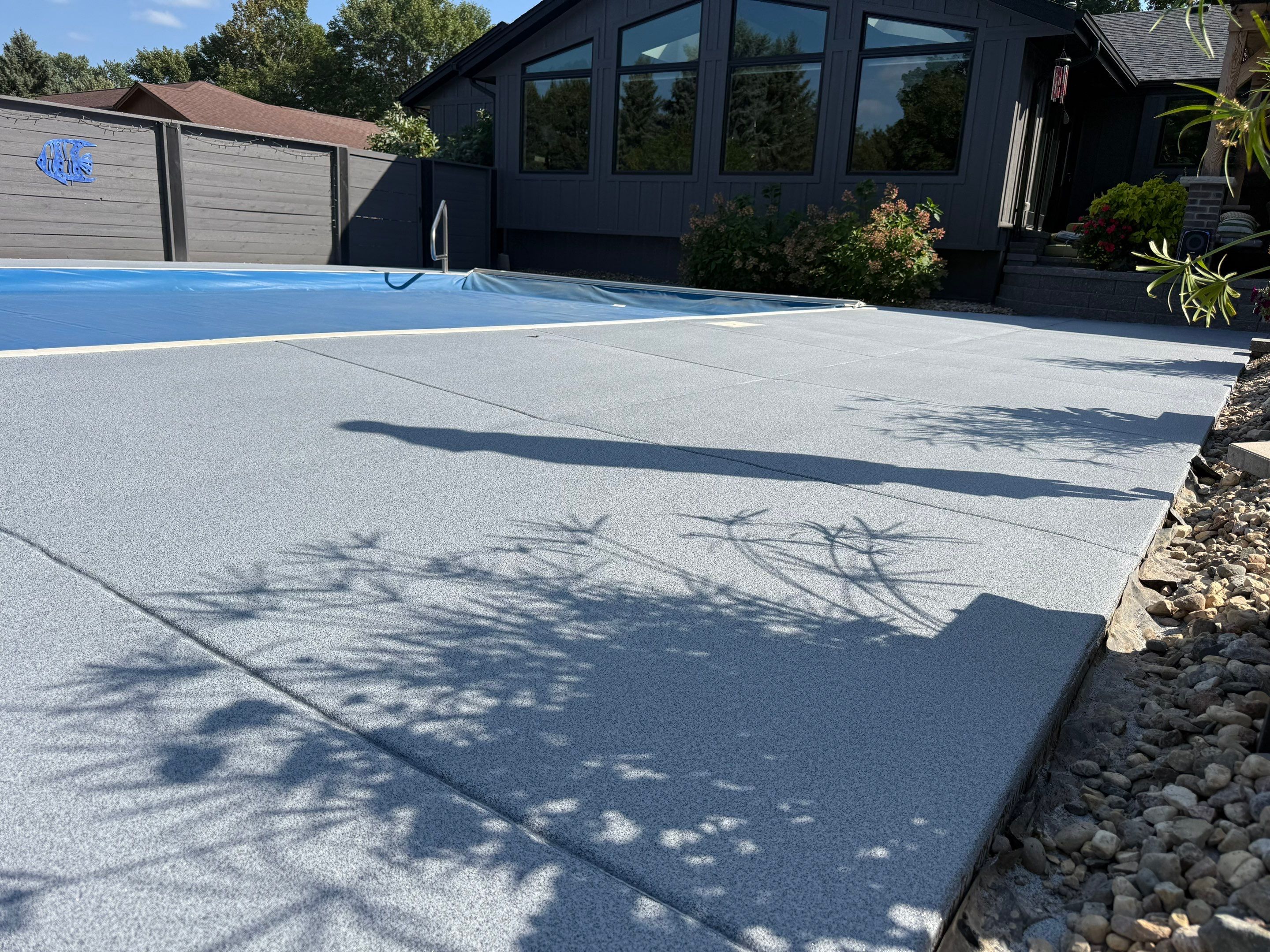 Garage Floor and Textured Pool Deck Coating in Sioux Falls by Select Painting, Coatings & Garage Cabinets