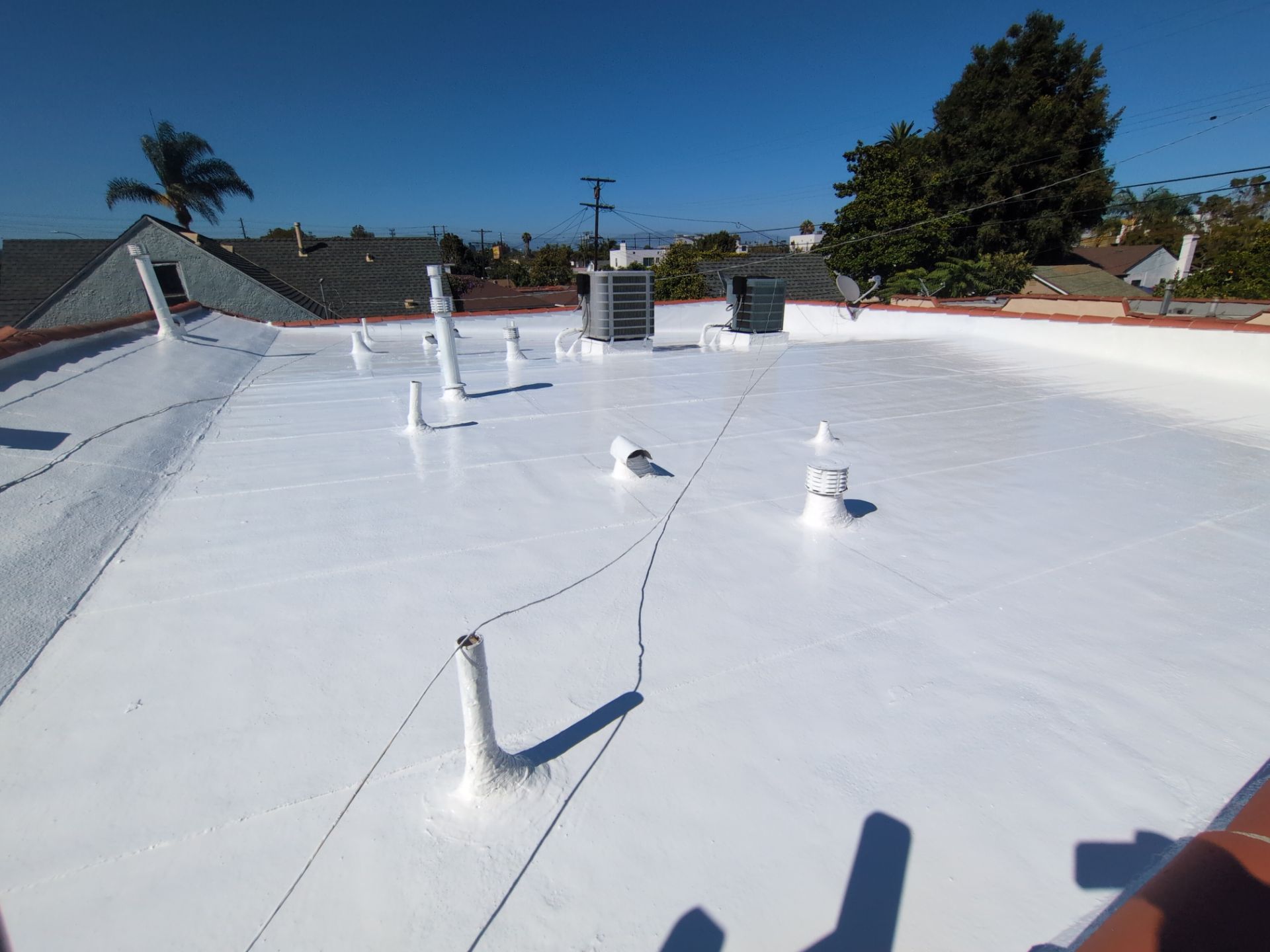 Los Angeles Flat Roof Restoration with White Reflective Coating by Hull Brothers Roofing