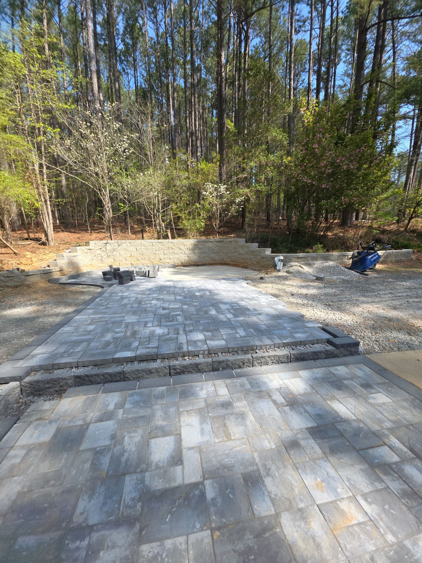 Pittsboro Outdoor Living Transformation – Retaining Wall, Paver Patio & Elevated Deck by Elite Remodeling and Design LLC