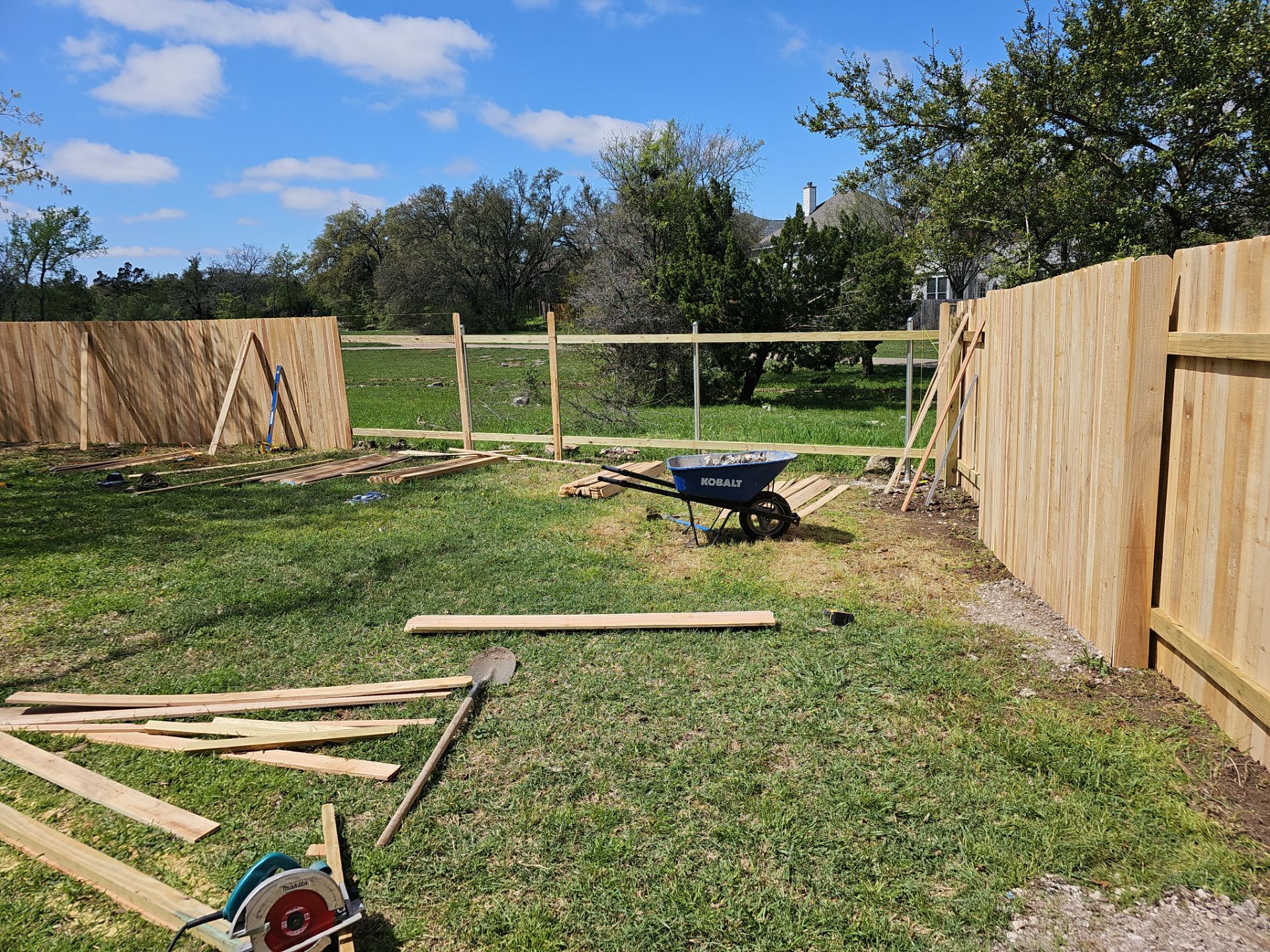 Fence Installation using Cedar Pickets by DeZign Roofing & Exteriors