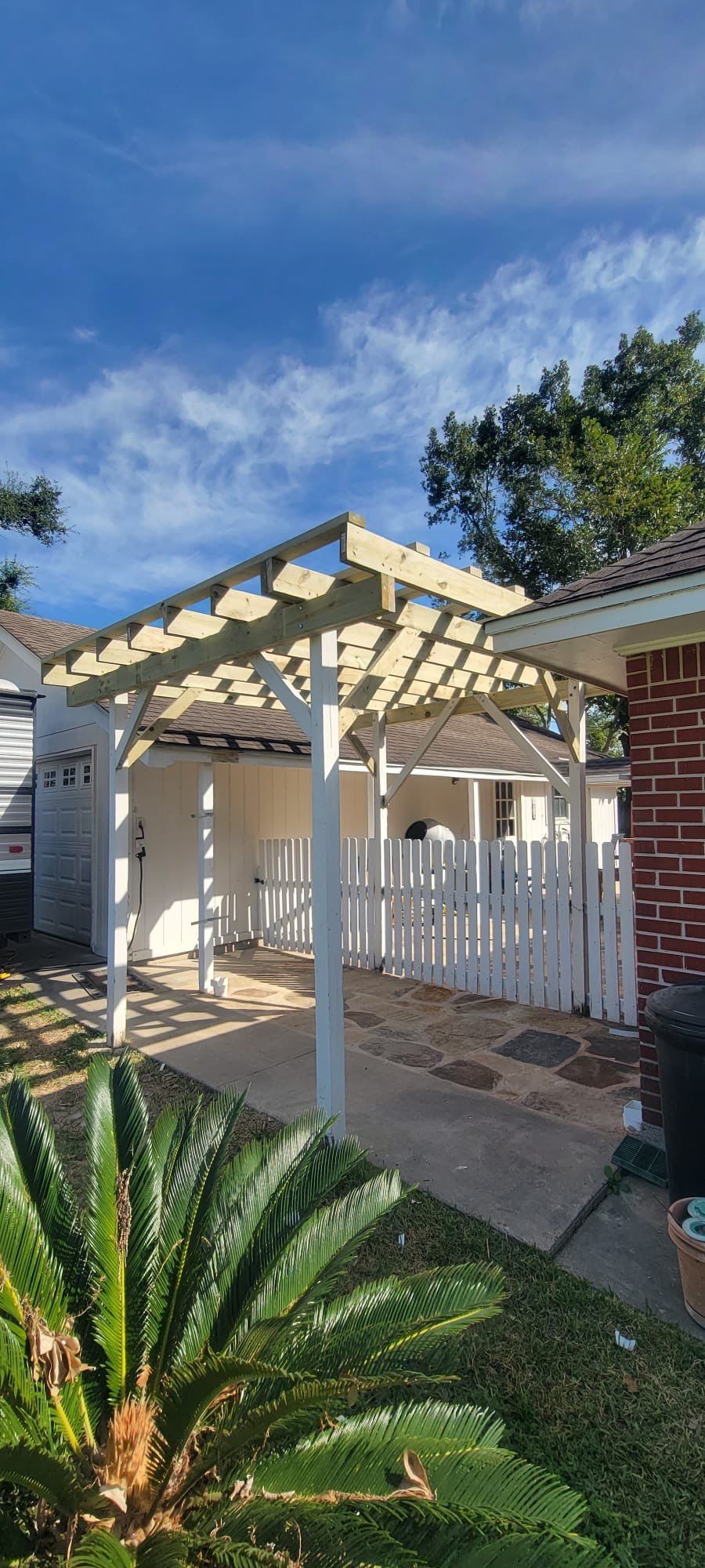 🌿 Rodney – Full Gutters, Drainage System, Flagstone Patio & Pergola  Alejandro and the Texas Urban Elements Team recently completed a multi-solution project for Rodney’s home, blending function with design.  ✅ Seamless Gutters We installed a complete 6” seamless gutter system around the home to properly redirect rainwater away from the foundation, protecting siding, paint, and landscaping while boosting curb appeal.  ✅ Drainage System A new PVC storm drainage system was integrated into the gutters and extended to carry roof runoff away from the house. This ensures water won’t pool near the foundation or the new patio area.  ✅ Flagstone Patio Ground We prepped, leveled, and installed a custom flagstone patio for Rodney—delivering both beauty and durability, creating a natural, timeless look that ties perfectly into the yard.  ✅ Pergola Addition To conclude, our framing team constructed a small pergola extension, providing Rodney’s patio with a shaded retreat for family and friends to enjoy.  ✨ Result: A fully protected and enhanced outdoor living space where drainage, stonework, and structure all work together for long-lasting performance and comfort.  📢 At Texas Urban Elements, we specialize in building solutions that protect homes while creating beautiful outdoor environments. by Texas Urban Elements