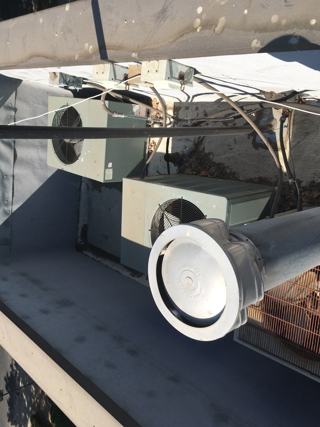 Spray foam and coatings inside commercial building HVAC well using Spray foam and coatings over existing BUR system by Straight Edge Roofing Inc