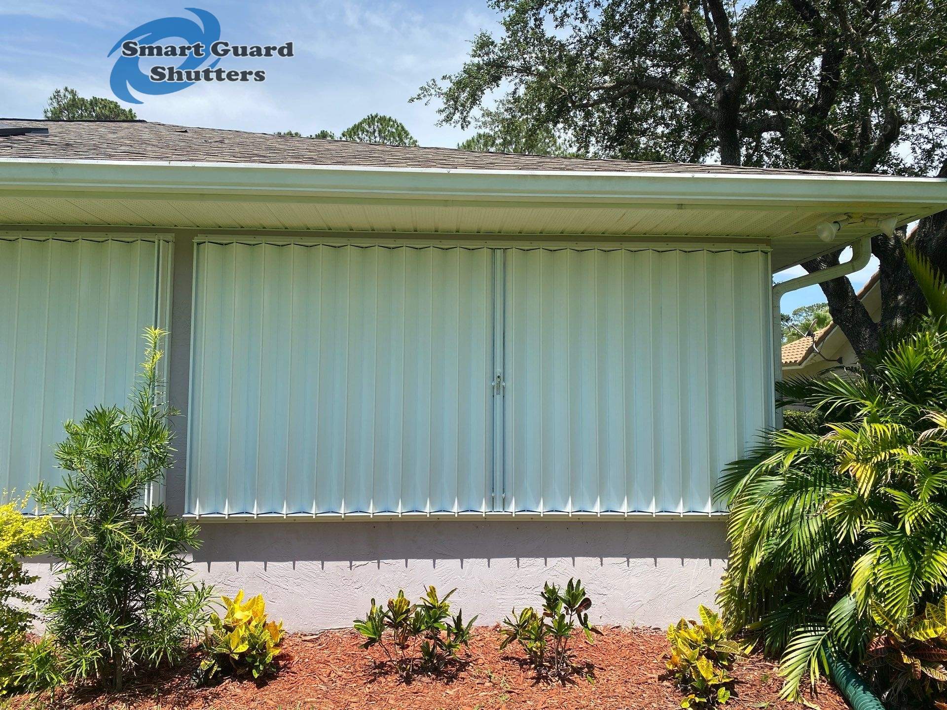 Accordion Shutters in White by Smart Guard Shutters