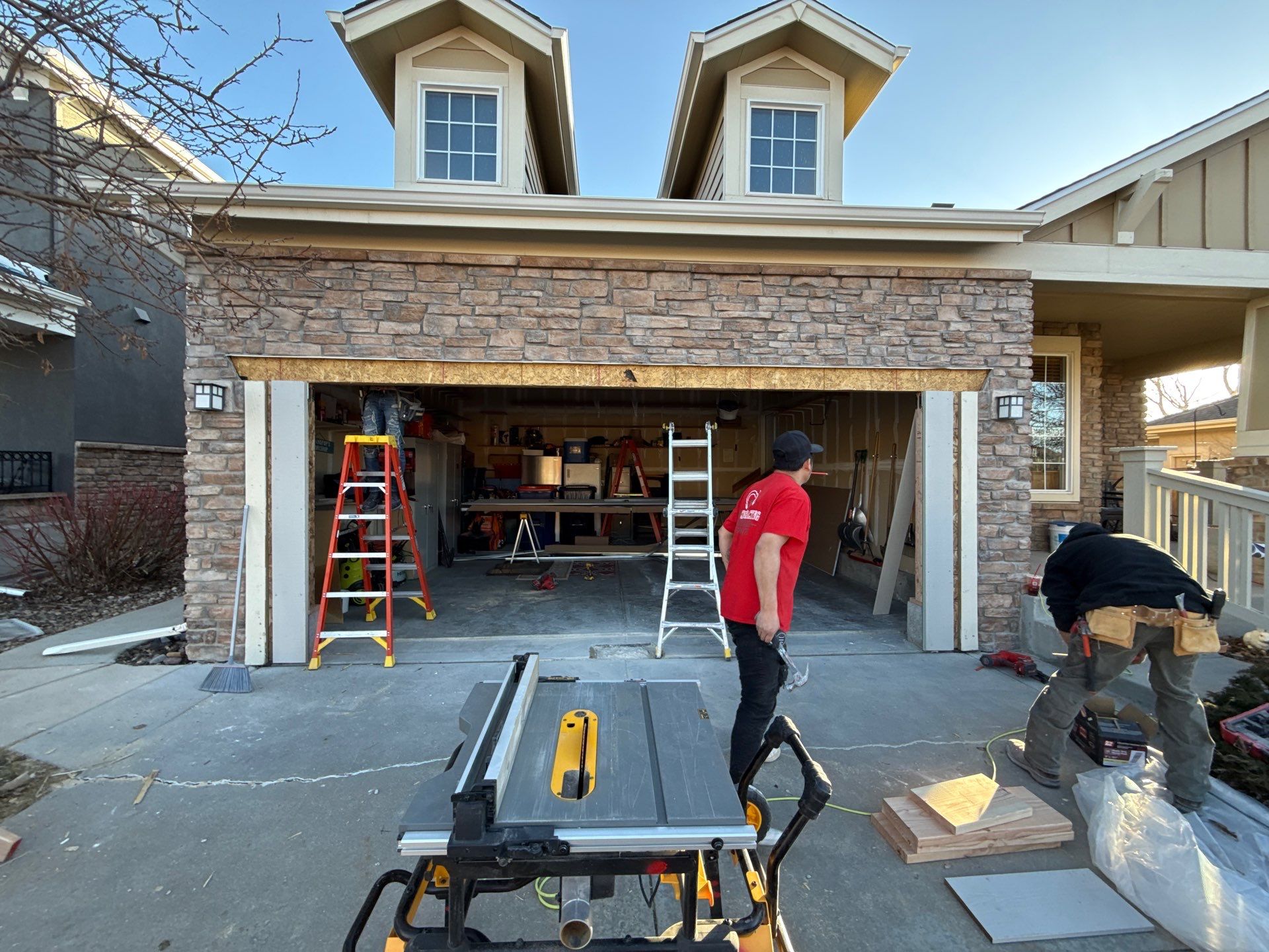 Garage door conversion by David & Goliath Contracting 