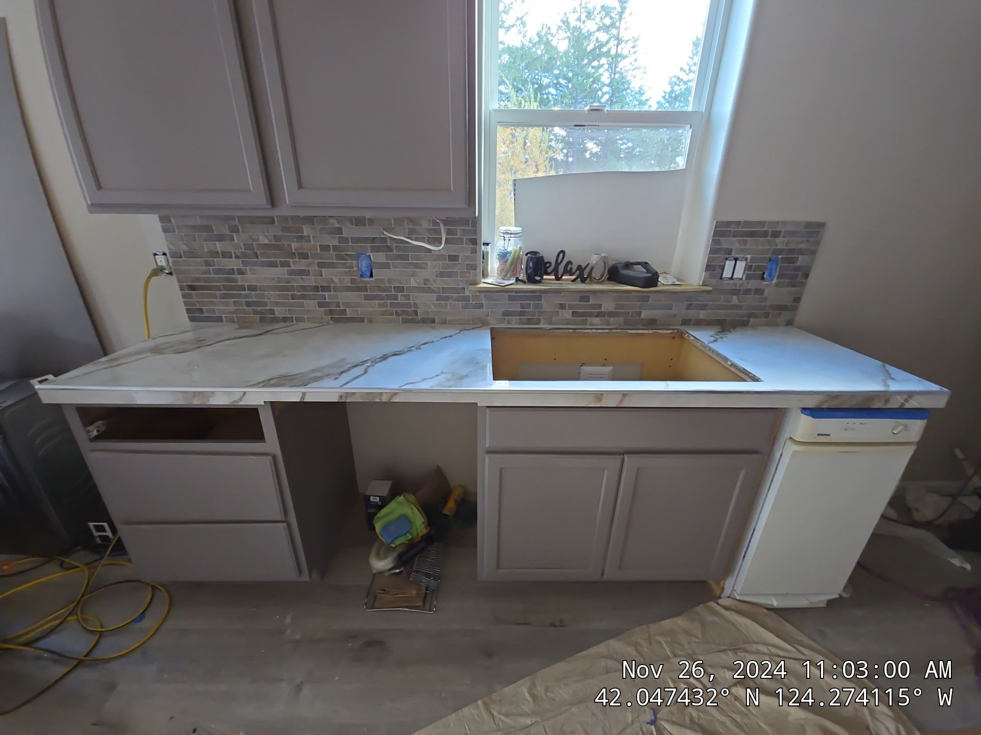 Marble Look Countertop and Stone Tile Backsplash Installation in Brookings by KMD Surfaces INC.