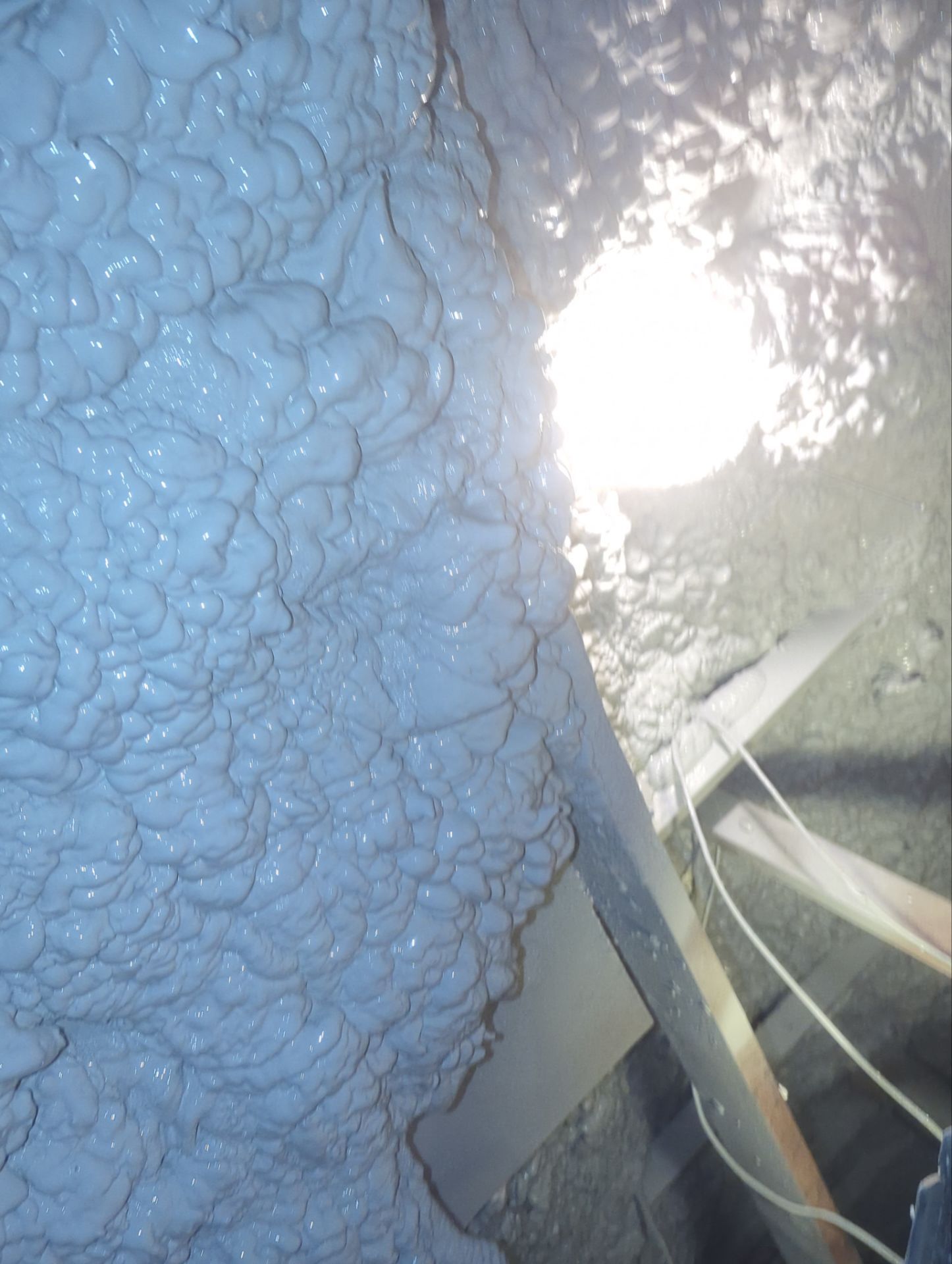 Attic Retrofit using open cell spray foam by NYS Foam & Energy