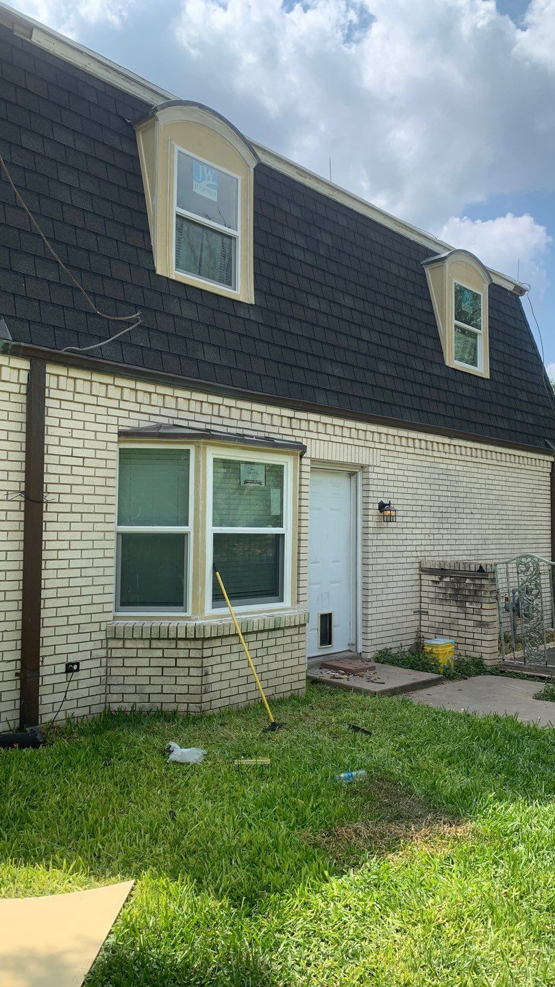 Mansard Charm by Bayfront Roofing and Construction