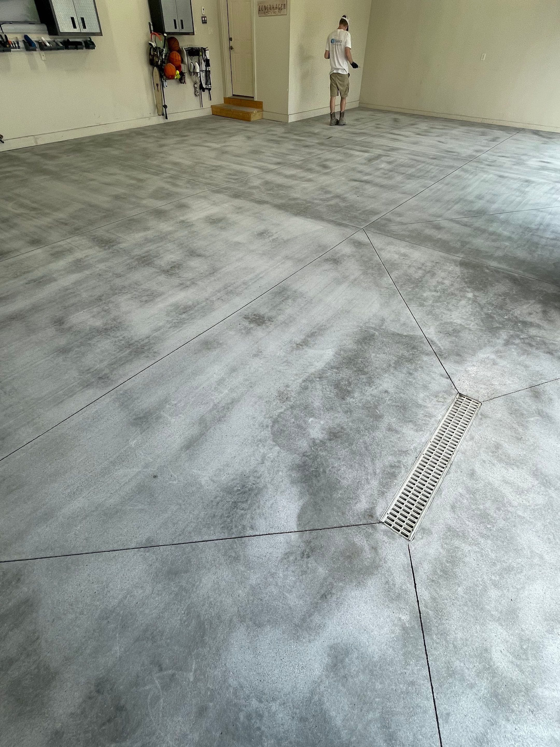 Coyote Flake Garage Floor Coating in Sioux Falls with Trench Drain by Select Painting, Coatings & Garage Cabinets