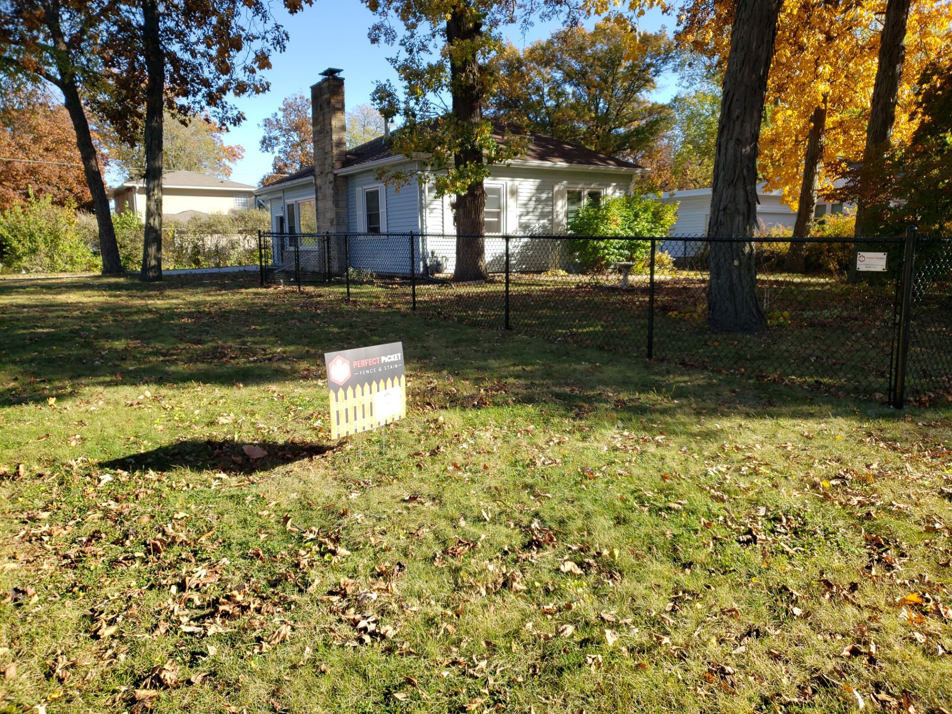 Black Chain Link Fence Installation in Cedar Falls, Iowa by Perfect Picket Fence and Stain