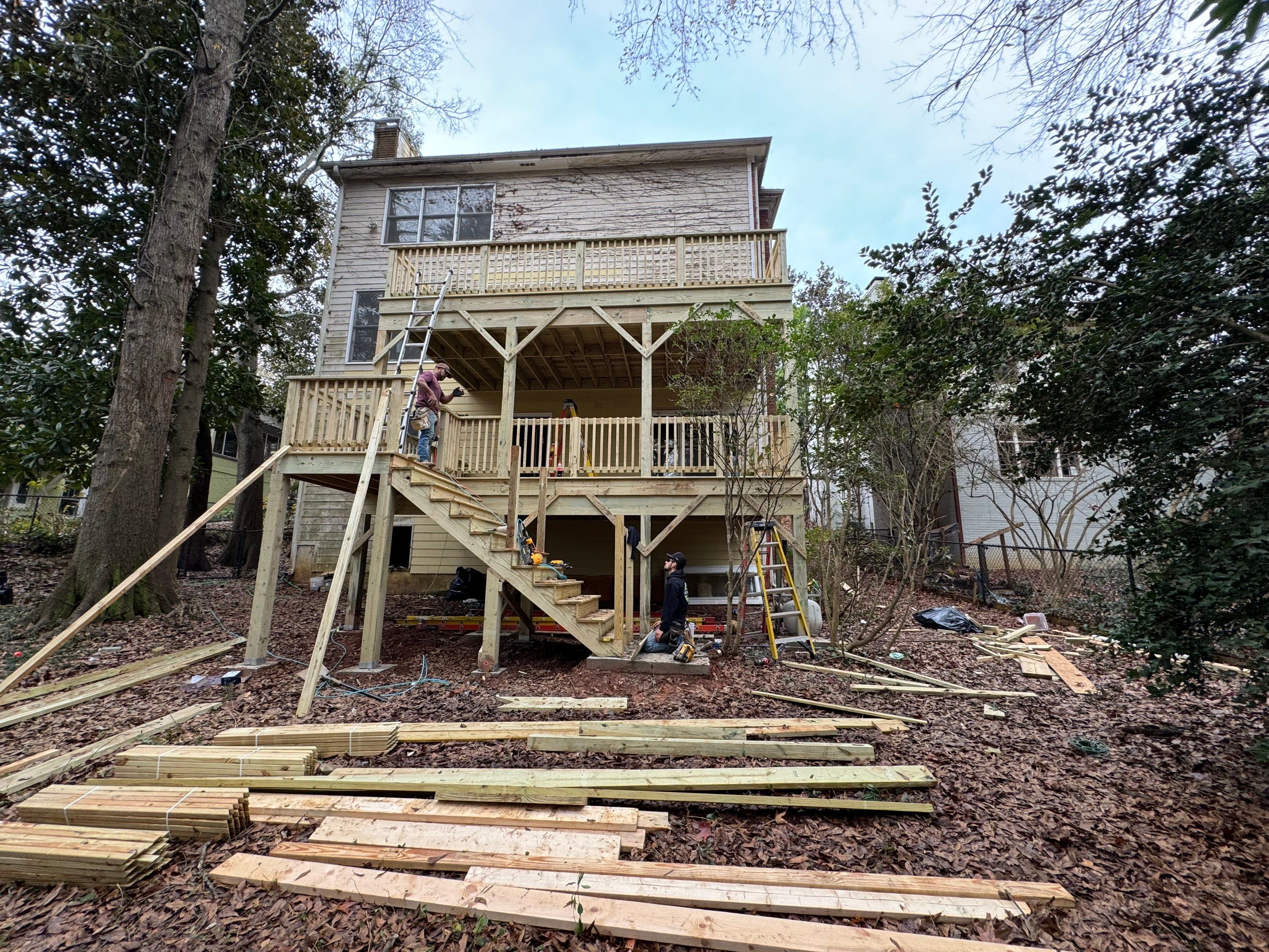 Multi-Level Pressure-Treated Wooden Deck Construction in Decatur by Swift Home Renovations