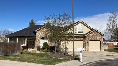 Beautifully maintained two story home with Duration Onyx Black located in Meridian
