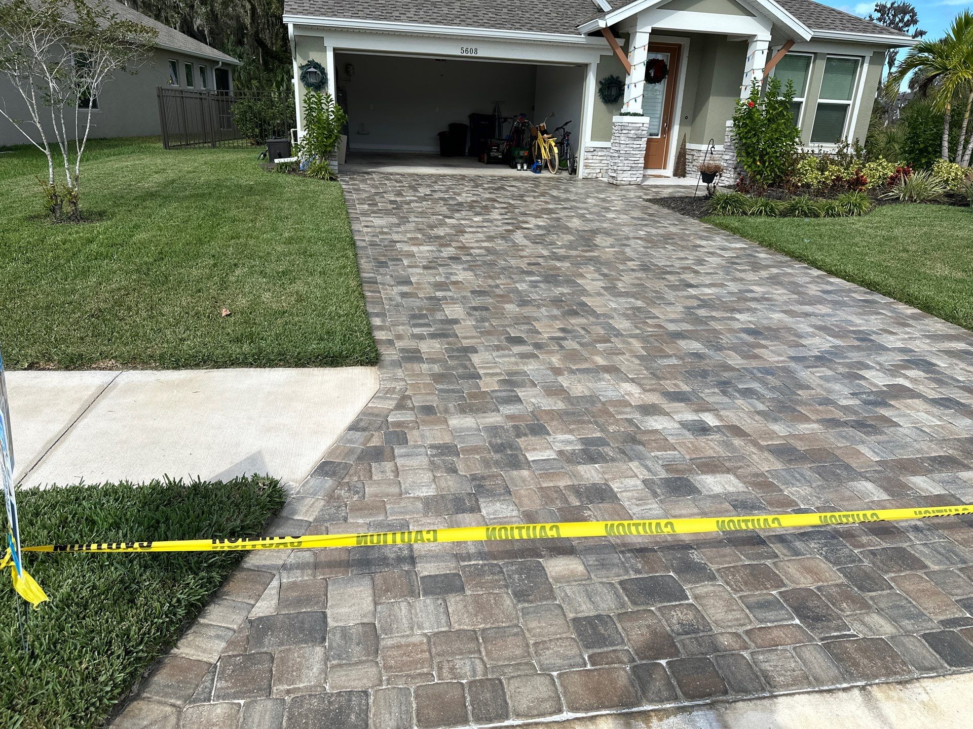 House Wash, Paver Driveway & Sidewalk Cleaning + Sanding & Sealing in Trevesta Community, Palmetto, FL by Sunshine AquaWash