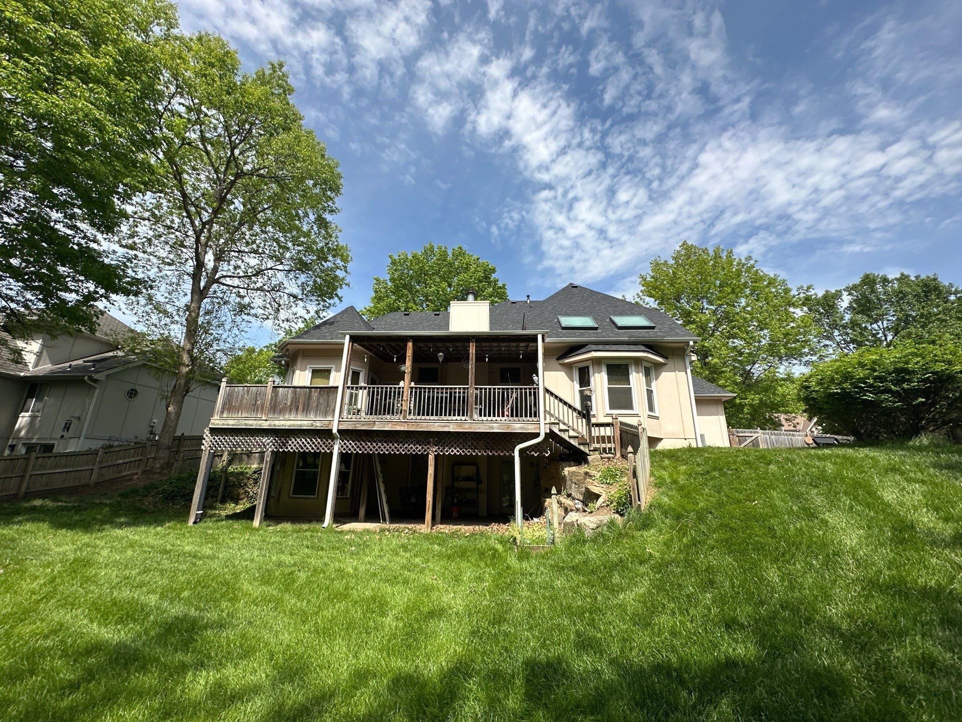 Comprehensive Roof Replacement and Skylight Installation in Kansas City by Liberty Roofing
