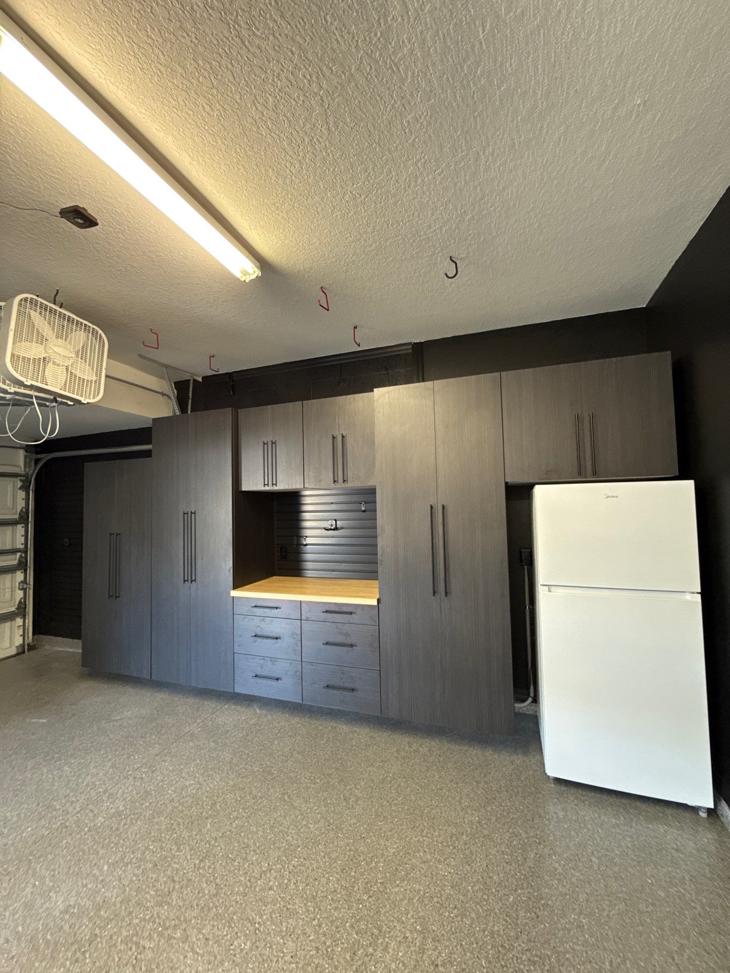 Full Garage Organization and Polyaspartic Floor Coating in Land O' Lakes by Square 1 Garage and Closet Solutions