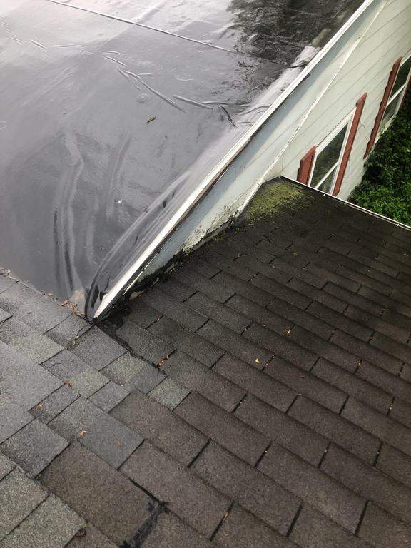 Residential Roofing Installation using 60 mil rubber roof  by Nitro Roofing and Construction