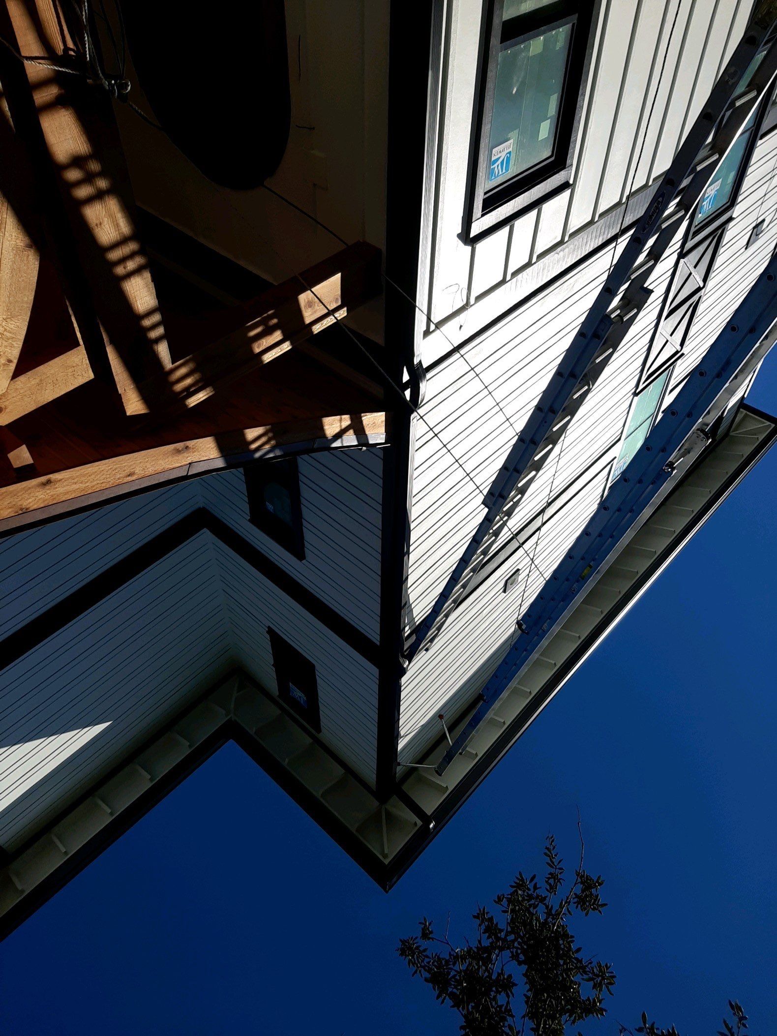 Seamless Gutter Installation Using Black Half Round Seamless Gutters by Gutter Professors